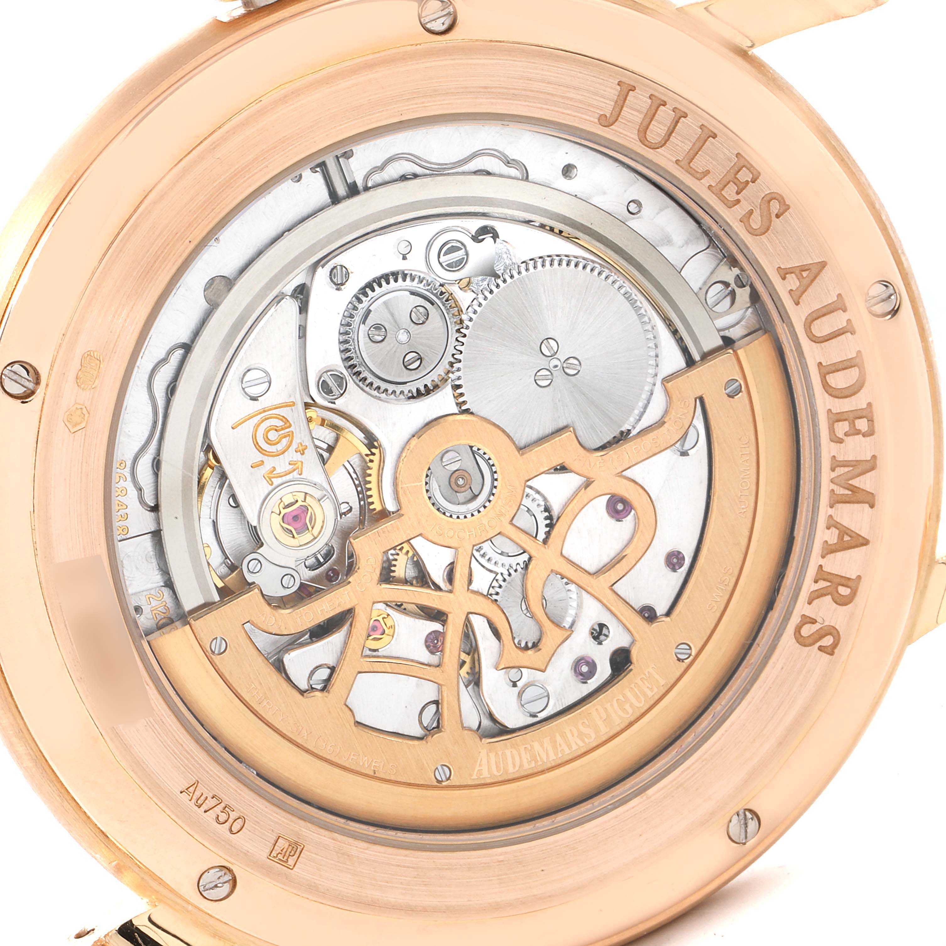 The image shows the intricate back view of the Jules Audemars model by Audemars Piguet, showcasing its gears and mechanisms.