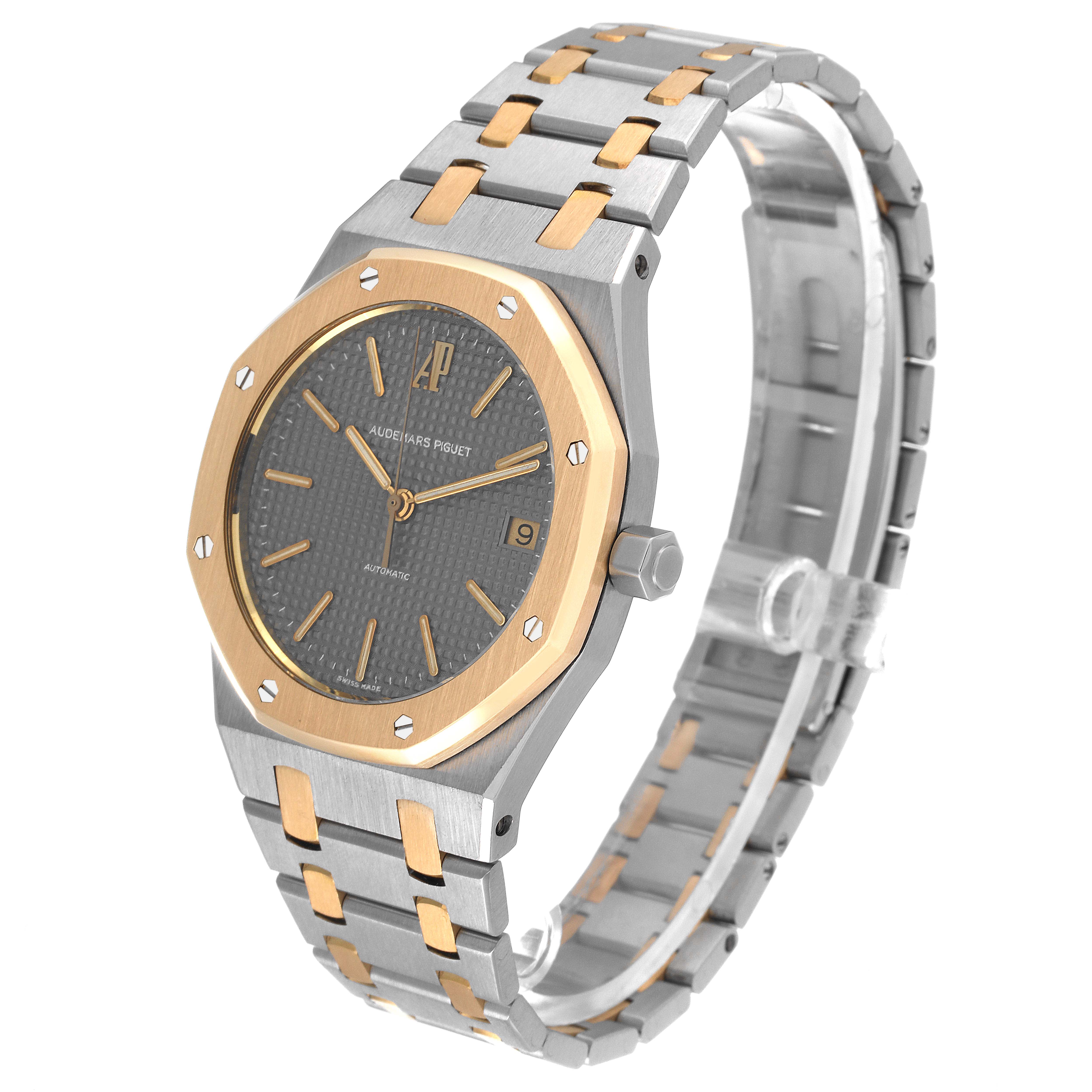 This image shows a Royal Oak model watch by Audemars Piguet at a three-quarter angle, highlighting its dial, bezel, and bracelet.