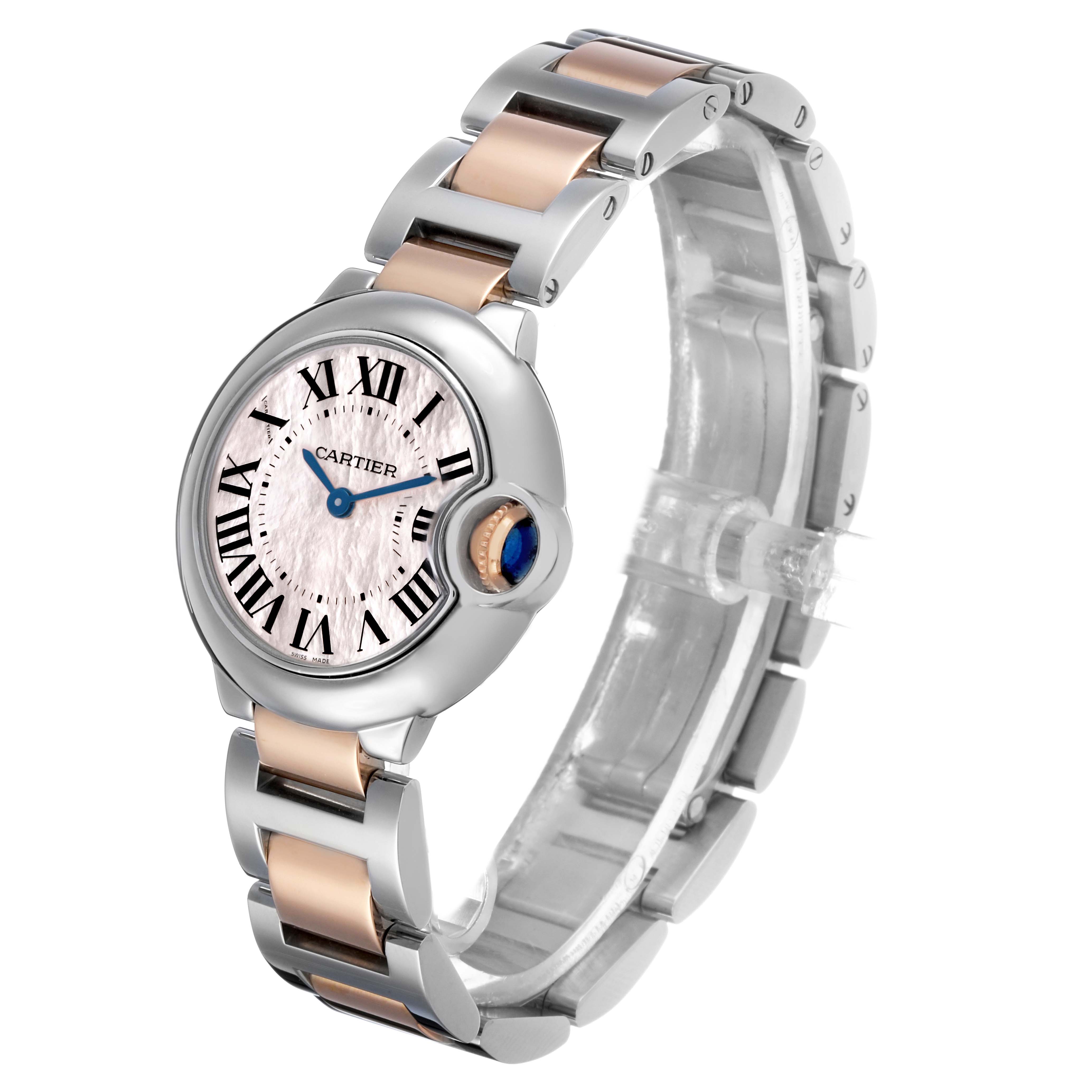 The Cartier Ballon Bleu W6920034 Women's Stainless Steel Mother of Pearl Dial watch is shown at an angle highlighting its face, bezel, crown, and bracelet.