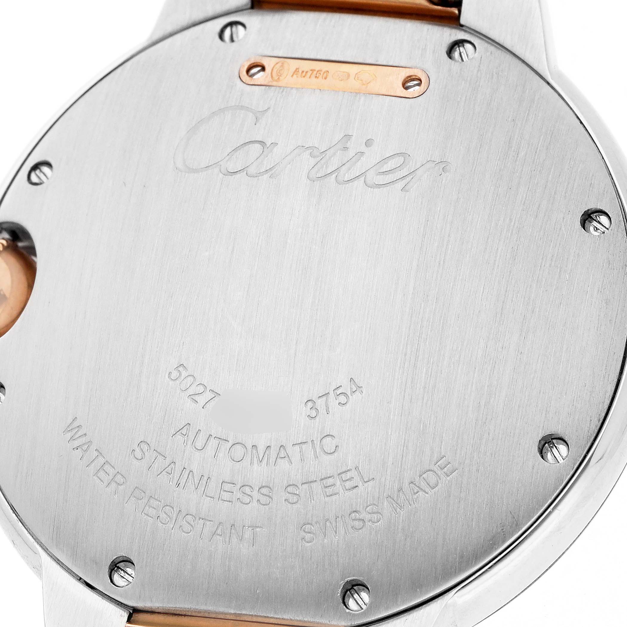 The image shows the back case of a Cartier Ballon Bleu W3BB0004 Men's Steel and Gold (two tone) Silver Dial watch, featuring branding and specifications engraving.