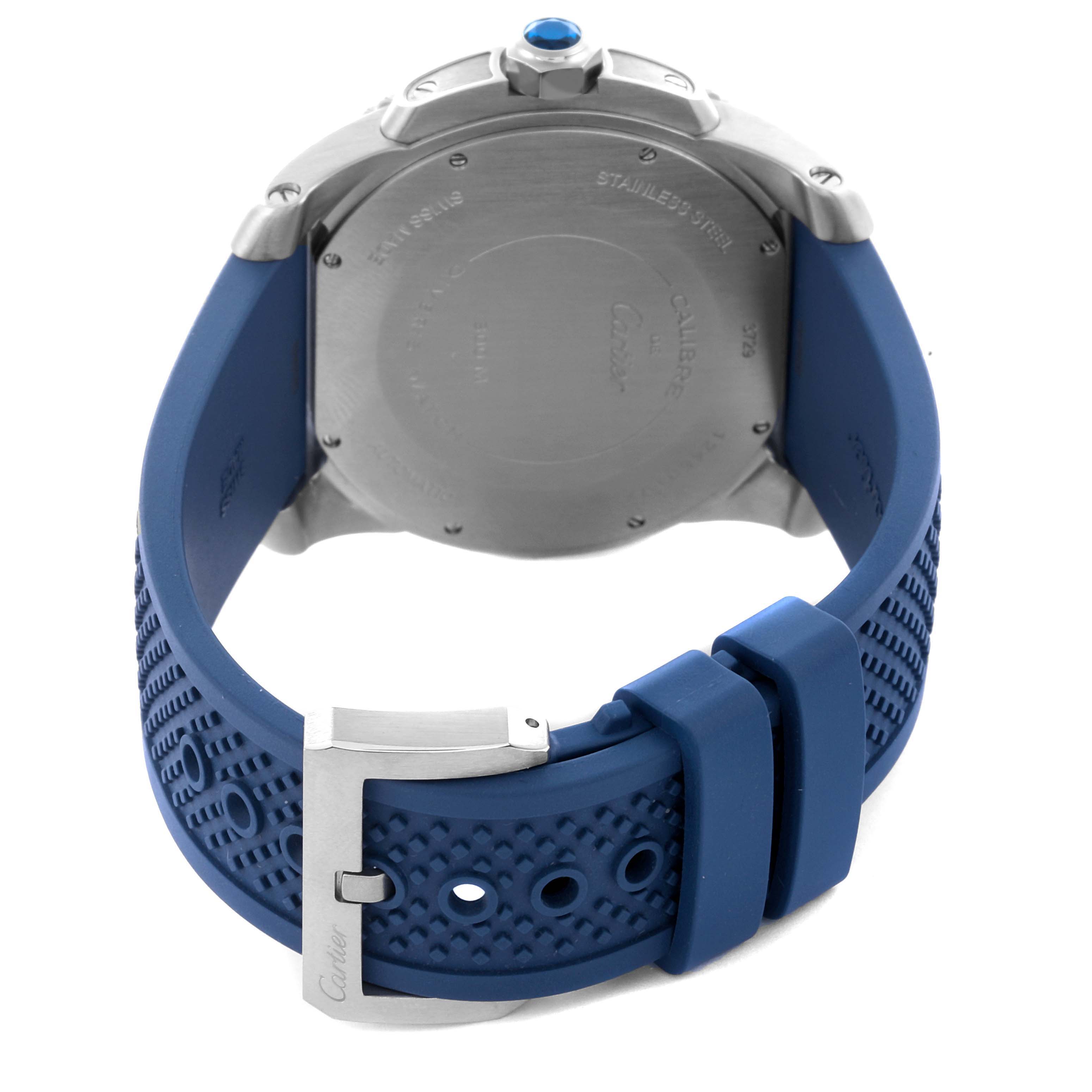The image shows the back case and blue rubber strap of a Drive de Cartier watch by Cartier, with the buckle visible.