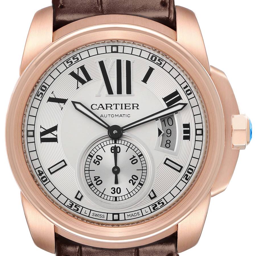 The Calibre de Cartier watch is shown from a front angle, highlighting the dial, bezel, and crown detail.