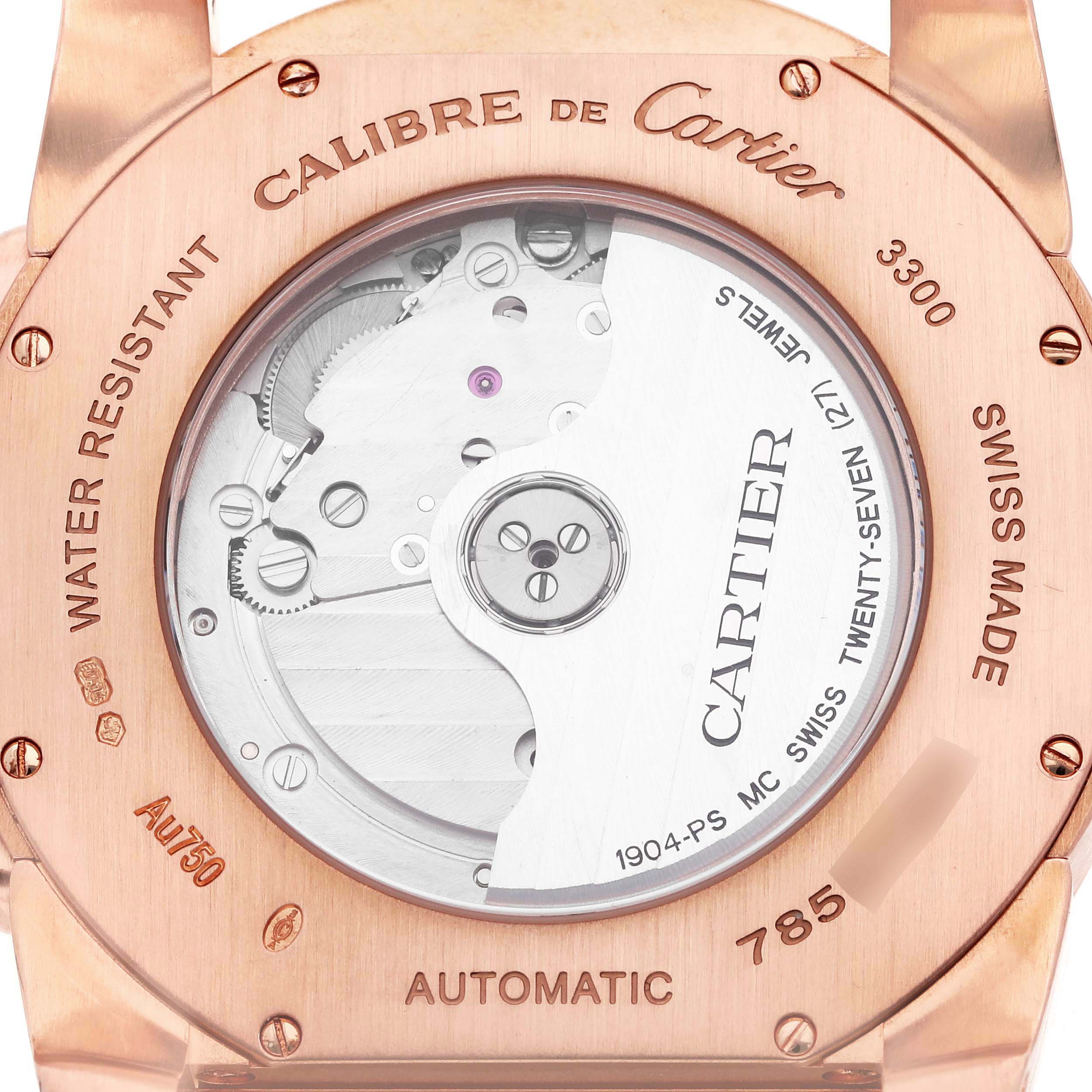 The image shows the back of the Cartier Calibre de Cartier W7100009 Men's Rose Gold Silver Dial W7100009 Men's Rose Gold Silver Dial watch, highlighting its automatic movement and stainless steel components.