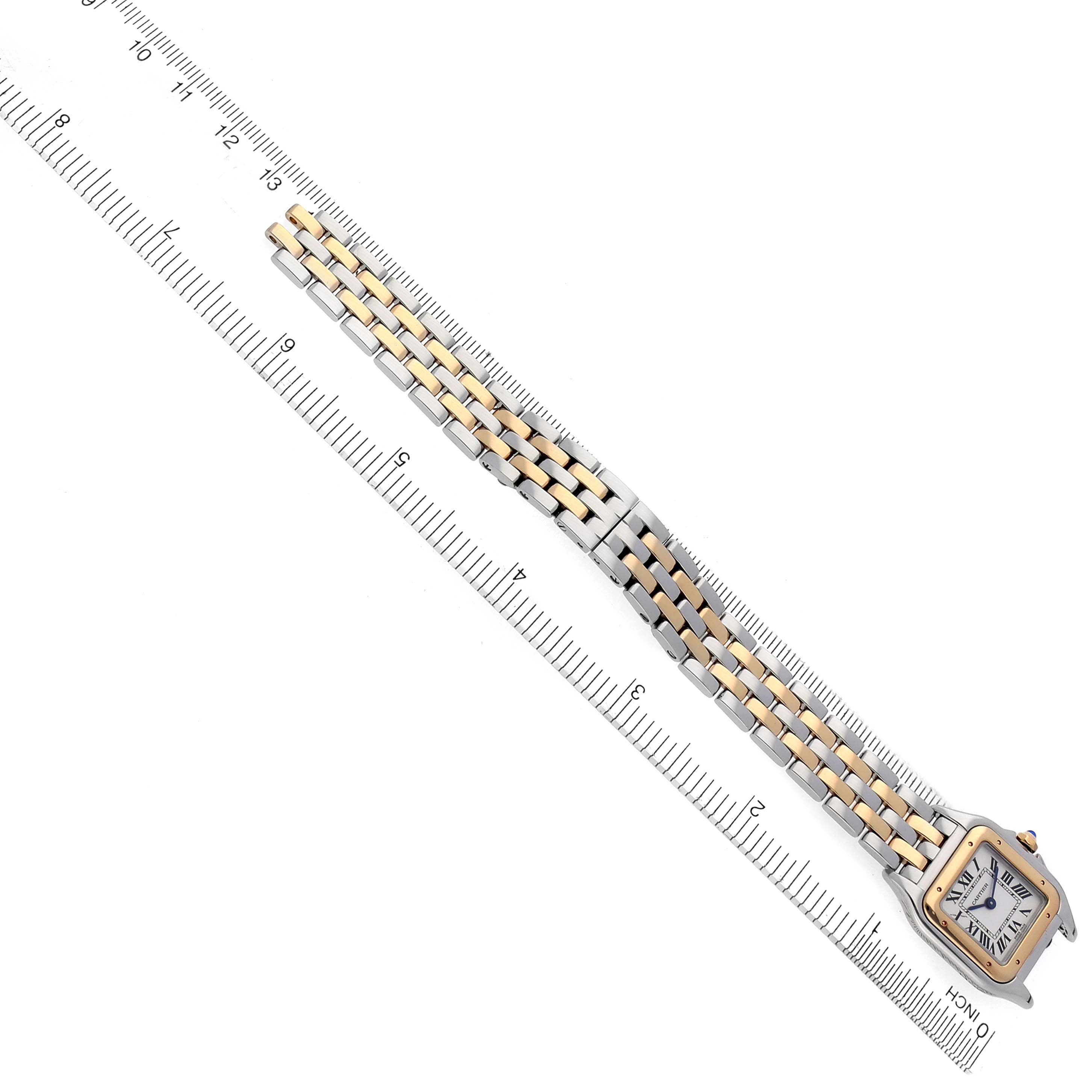 The Cartier Panthere W2PN0006 Women's Steel and Gold (two tone) Silver Dial W2PN0006 Women's Steel and Gold (two tone) Silver Dial watch is shown from a top-down angle, displaying the face, bezel, and bracelet alongside a ruler.