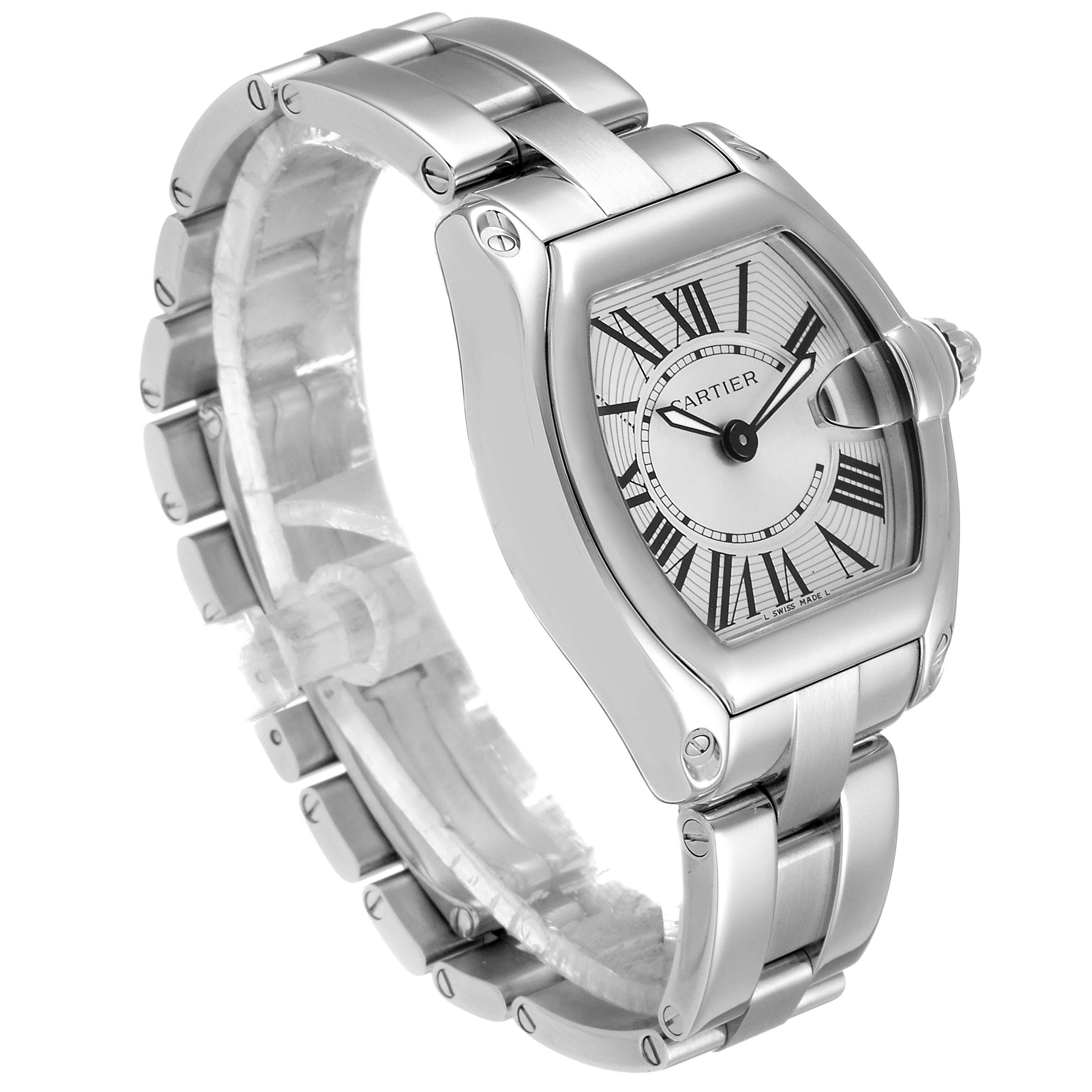 The Cartier Roadster W62016V3 Women's Stainless Steel Silver Dial W62016V3 Women's Stainless Steel Silver Dial watch is shown at a front-side angle, displaying its stainless steel bracelet and tonneau-shaped case.