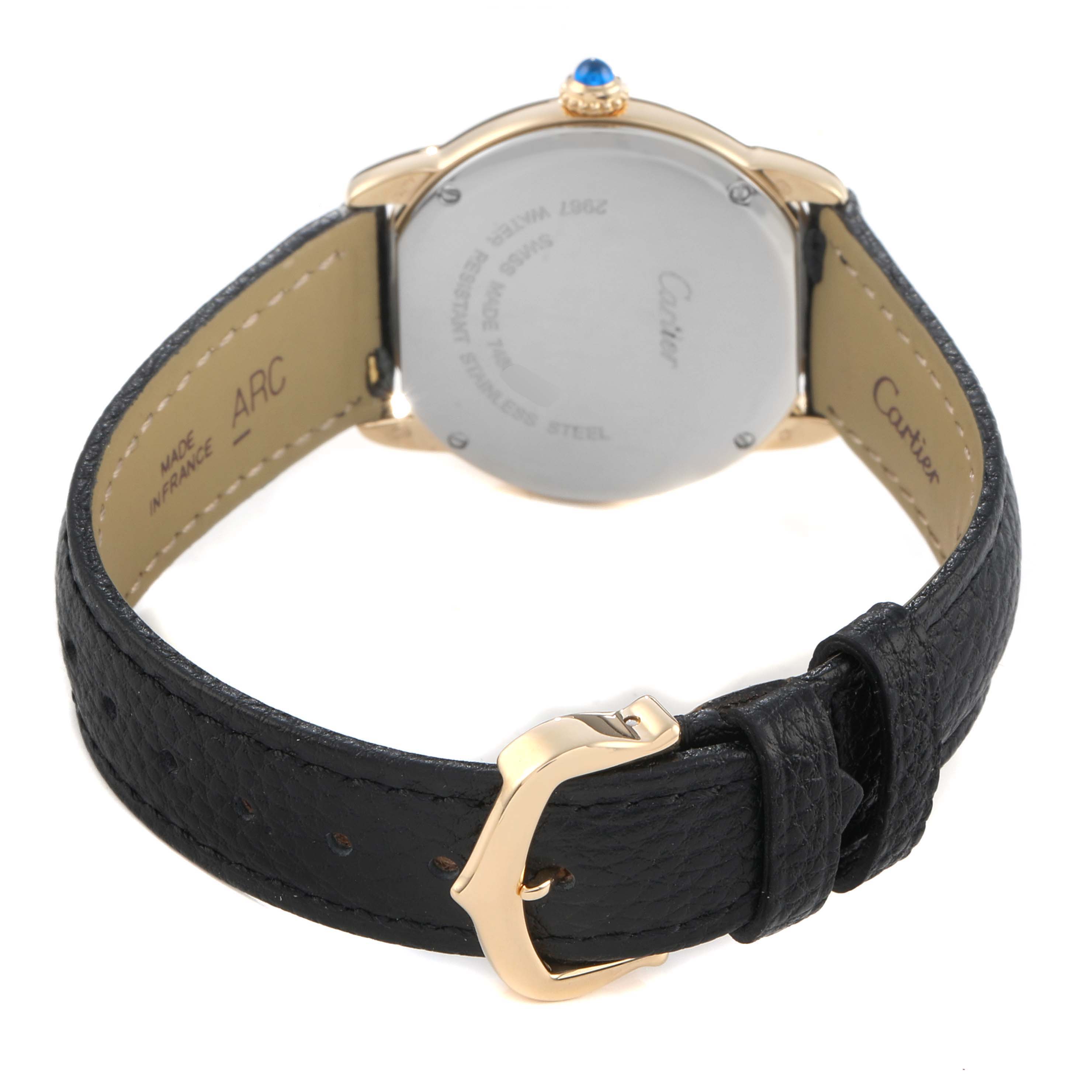 The Cartier Ronde W6700355 Women's Steel and Gold (two tone) Silver Dial watch is shown from the back, highlighting the case back, leather strap, and gold buckle.