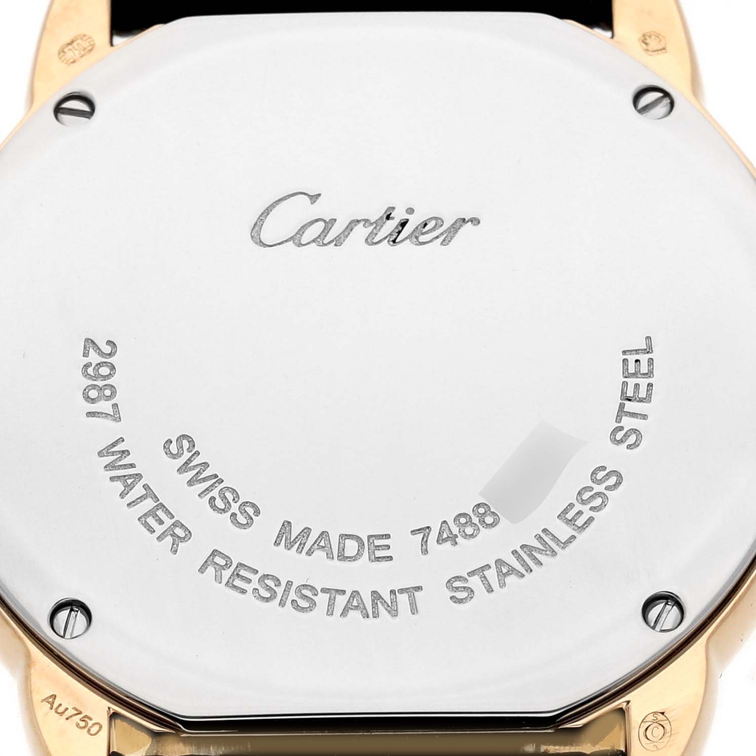 The image shows the back case of a Cartier Ronde W6700355 Women's Steel and Gold (two tone) Silver Dial watch with engraved details and screws visible.