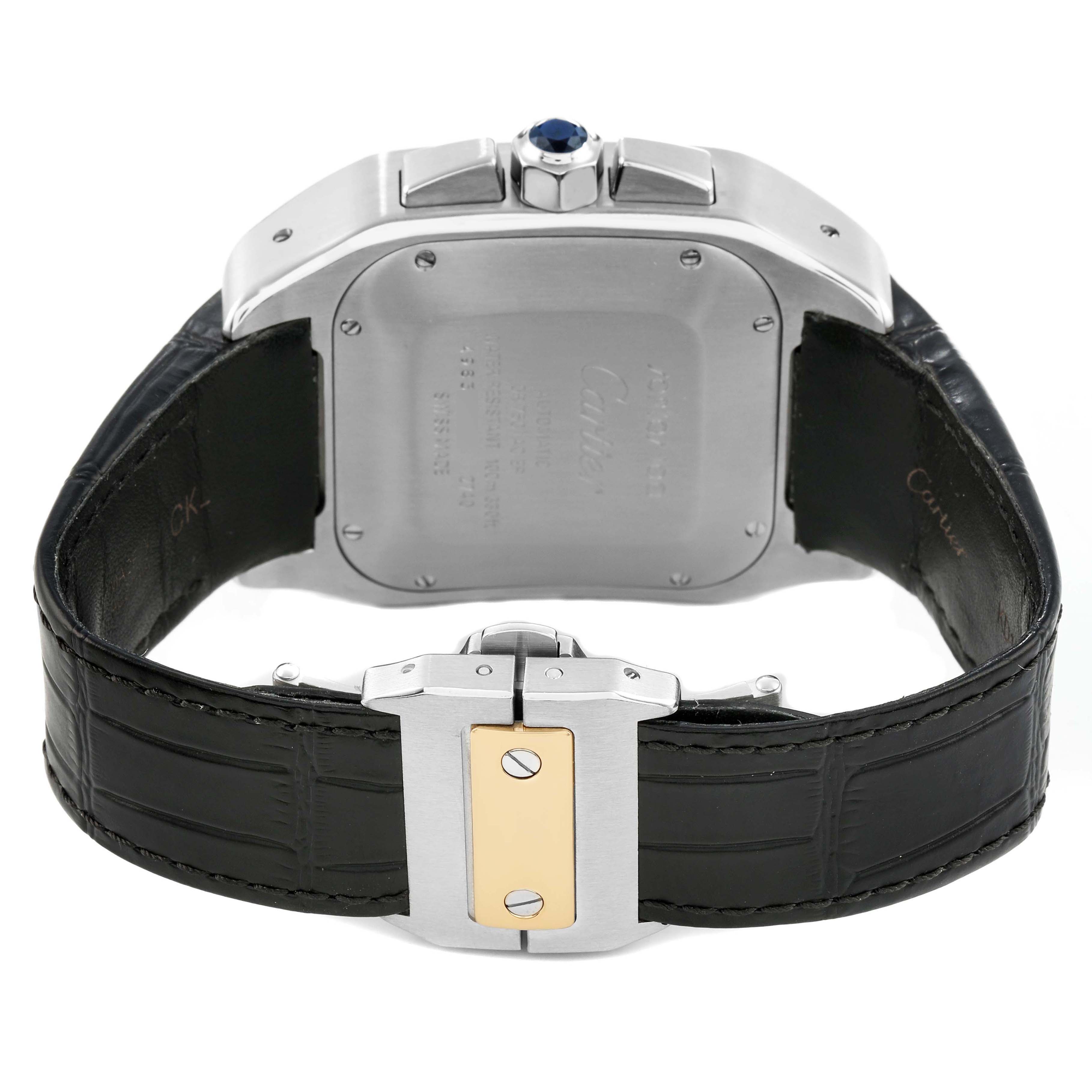 The Cartier Santos W20091X7 Men's Stainless Steel Silver Dial watch is shown from the back, highlighting the case back, black leather strap, and clasp.