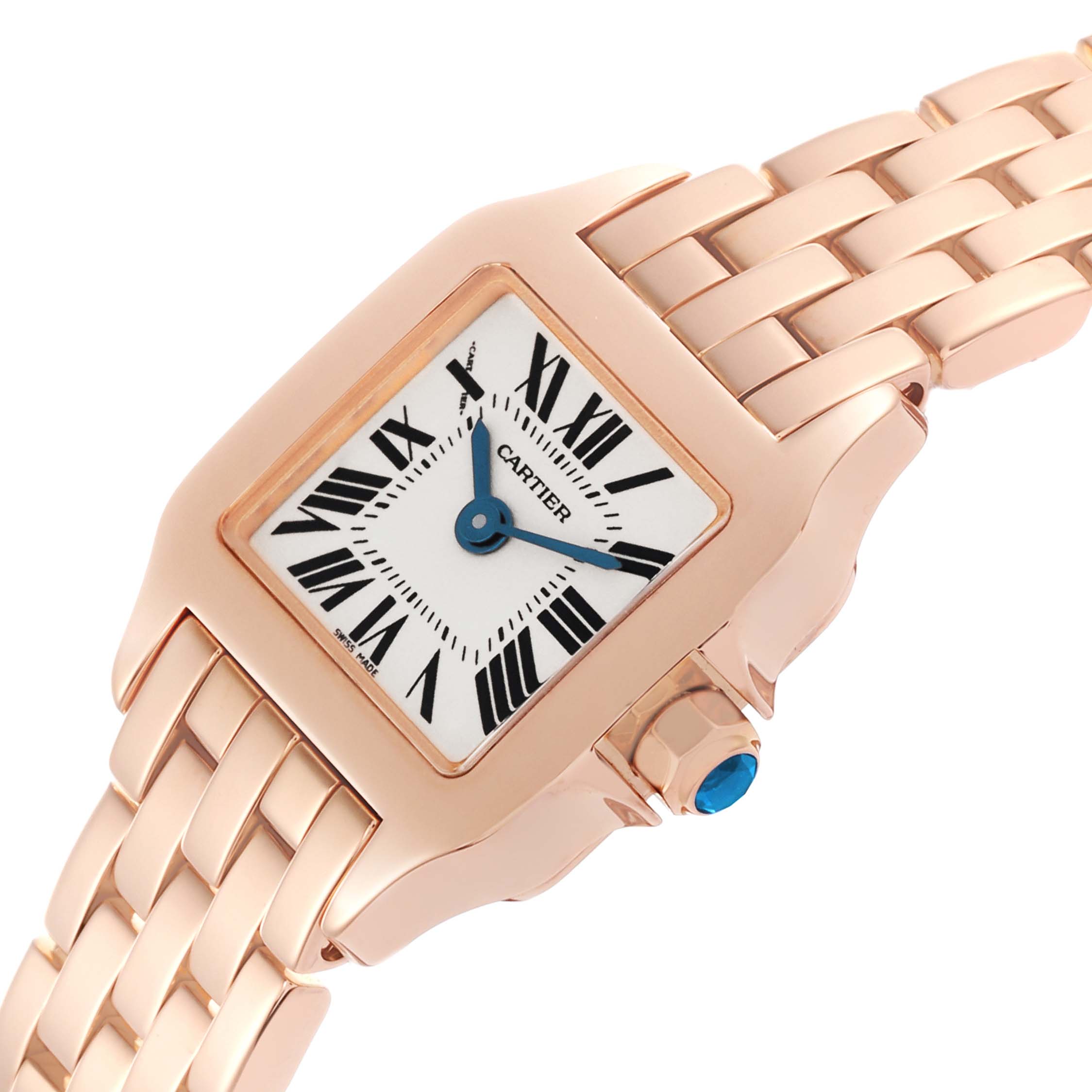 The image shows a Cartier Santos Demoiselle W25077X9 Women
s Rose Gold Silver Dial W25077X9 Women
s Rose Gold Silver Dial watch at an angled view, highlighting its face, bracelet, and crown with a blue cabochon.