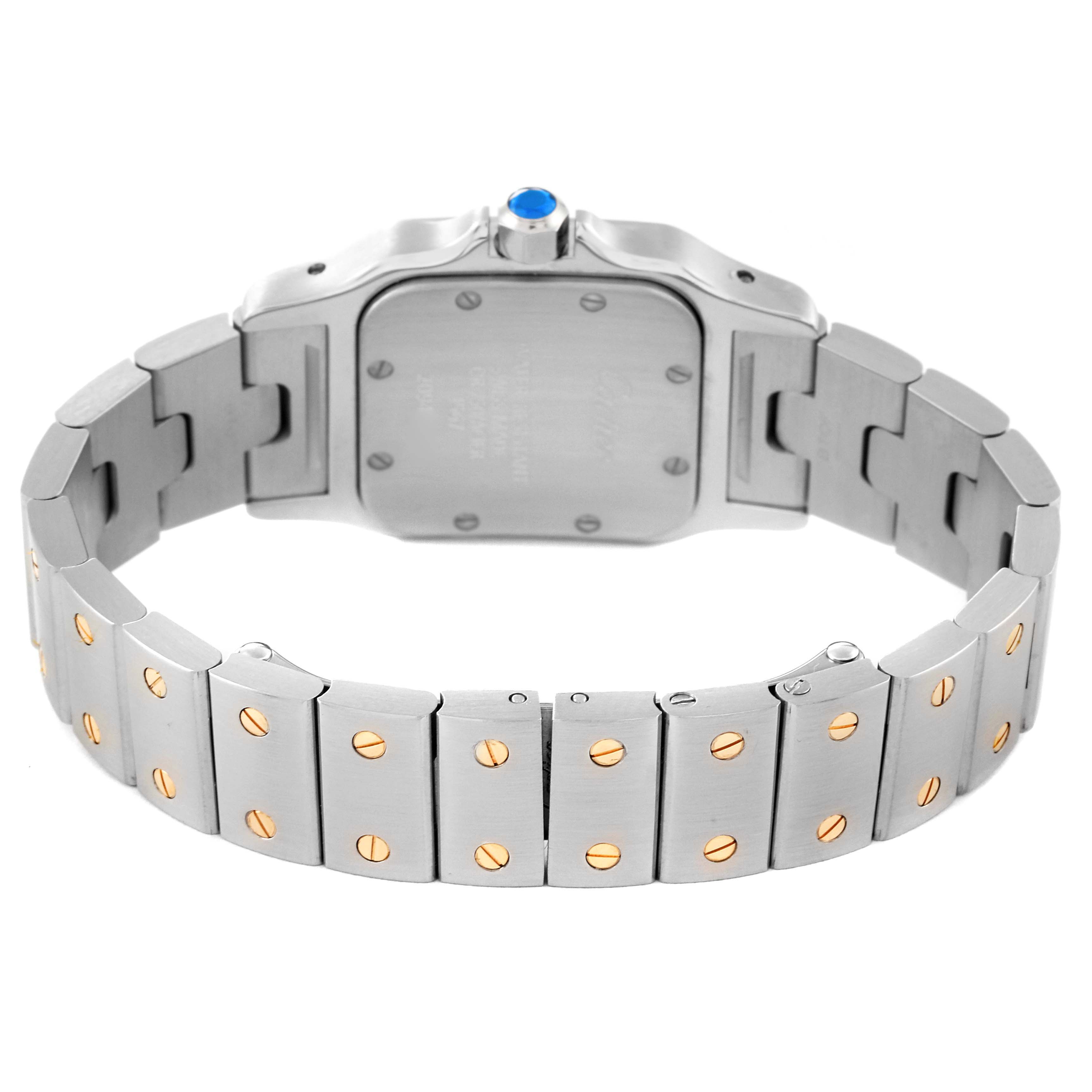 The image shows the back view of a Cartier Santos W20012C4 Women's Steel and Gold (two tone) Silver Dial W20012C4 Women's Steel and Gold (two tone) Silver Dial watch, highlighting its stainless steel and gold screw bracelet and case back.
