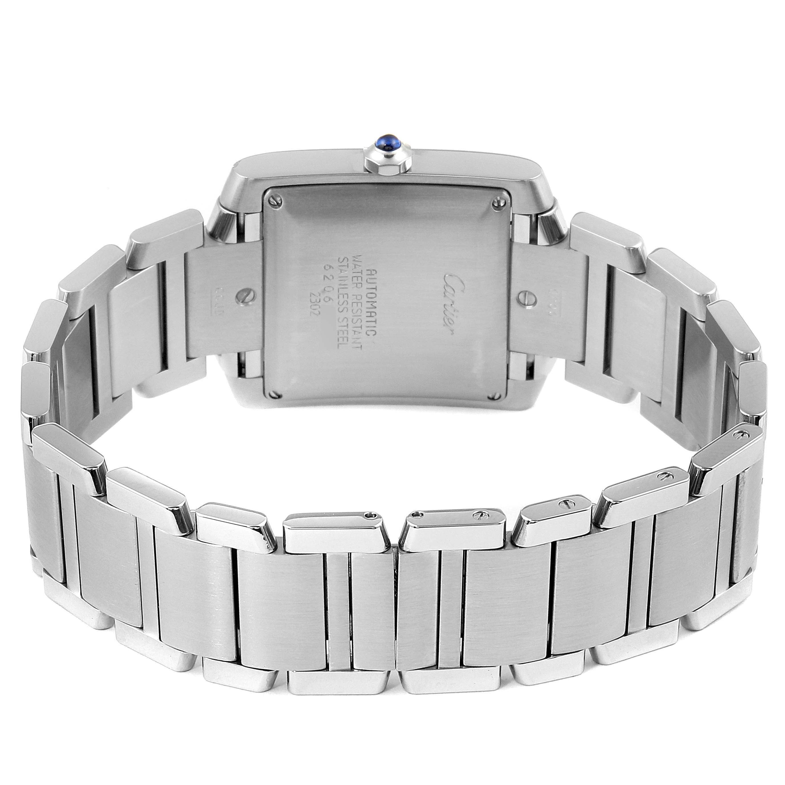 The image shows the back and bracelet of a Cartier Tank Française watch, highlighting its stainless steel links and case back.