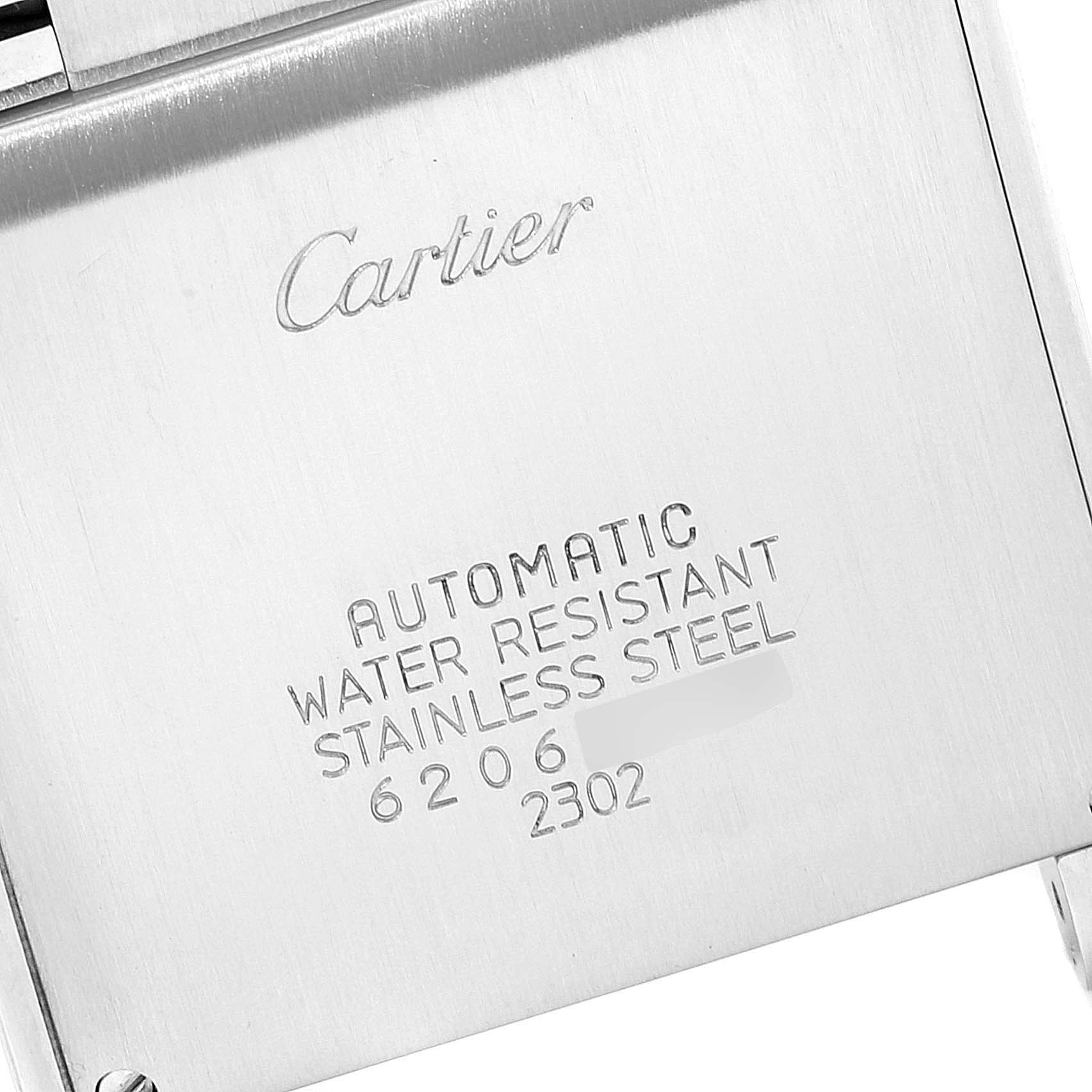 This image shows the backside of a Tank Francaise watch by Cartier, highlighting its engraved specifications.