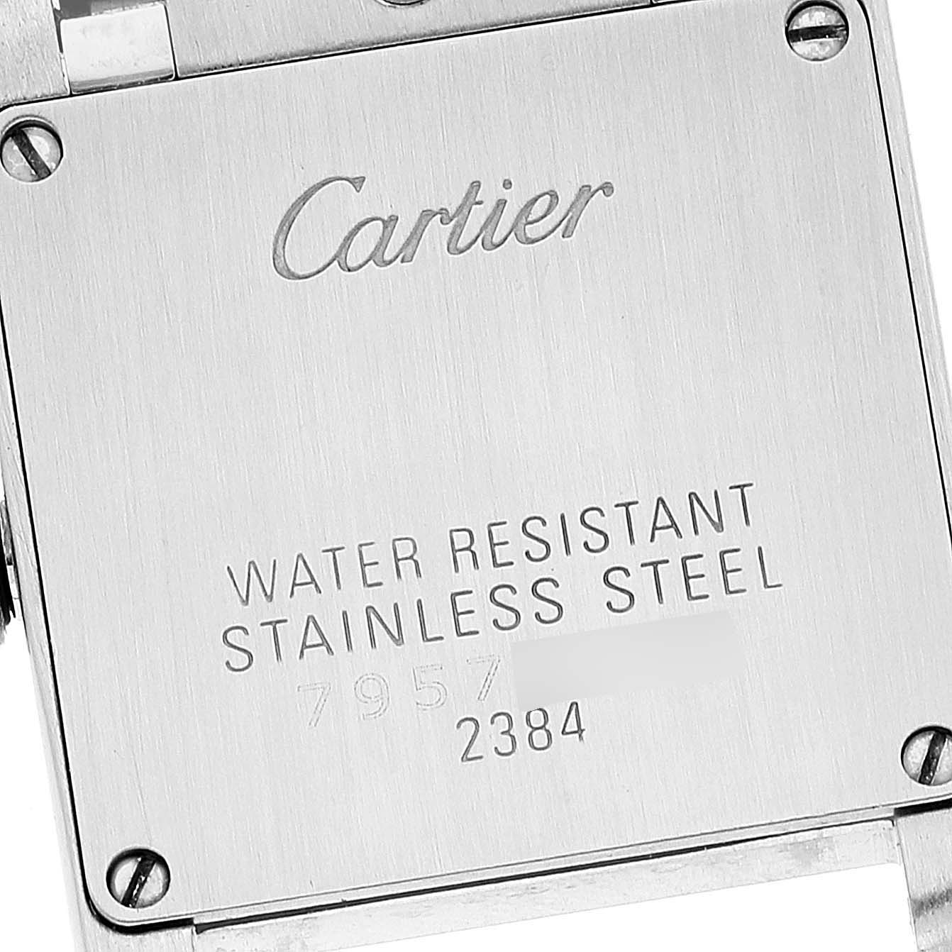 This image shows the case back of a Cartier Tank Française watch, displaying brand markings and details.