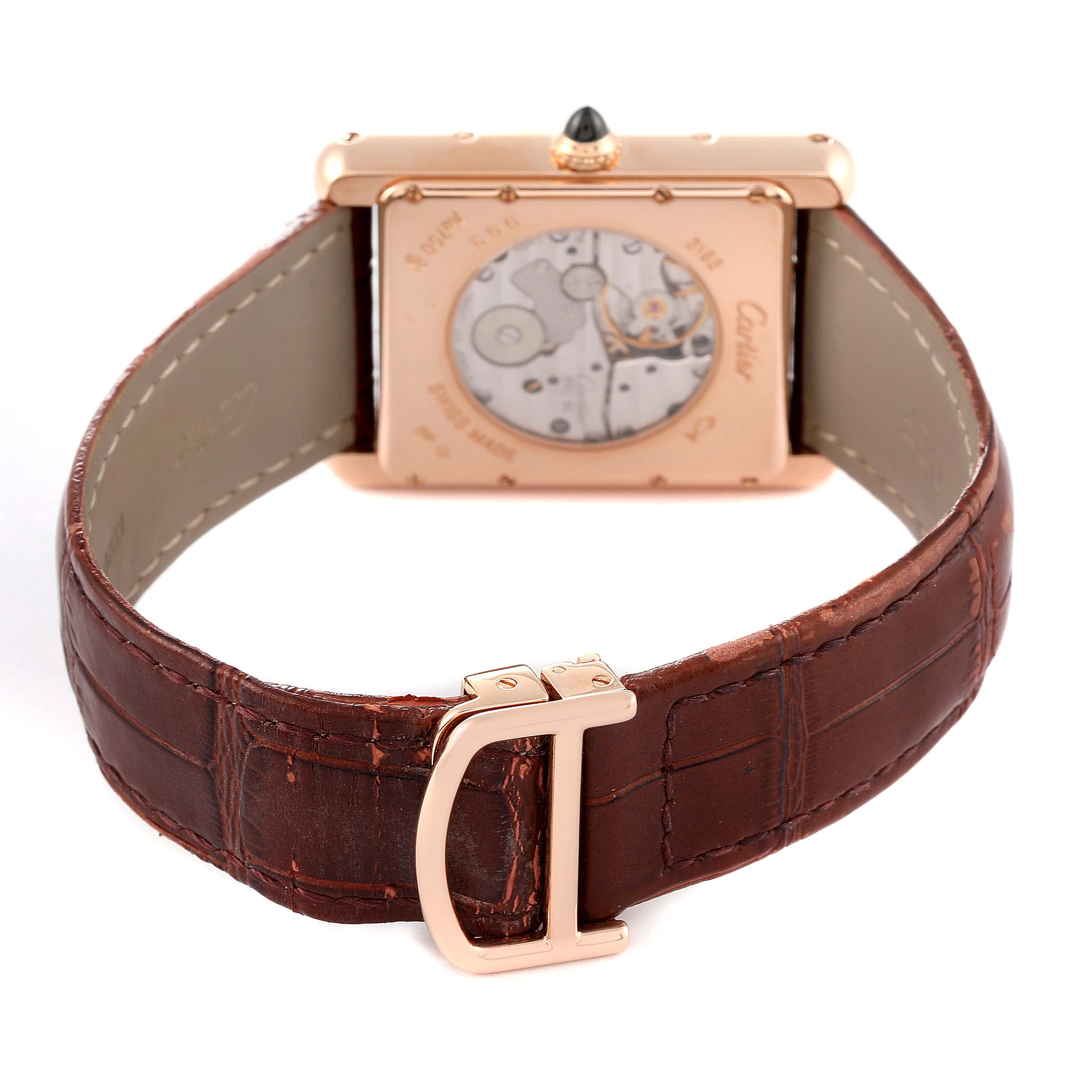 The image shows the back view of a Tank Louis Cartier watch, highlighting its mechanical movement and brown leather strap.