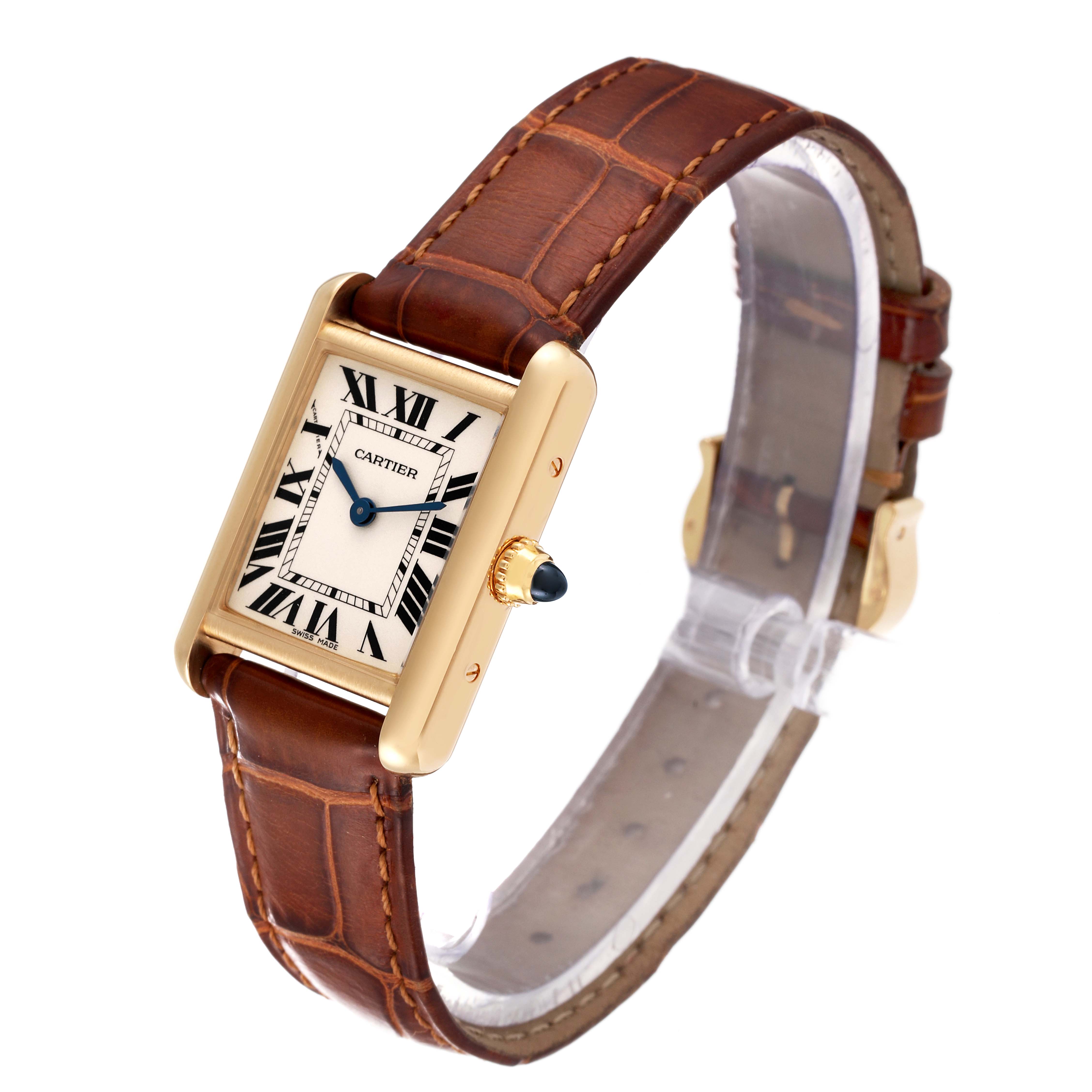 The Cartier Tank Louis W1529856 Women's Yellow Gold Silver Dial W1529856 Women's Yellow Gold Silver Dial watch is shown at an angled view, highlighting its rectangular face, gold case, and brown leather strap.