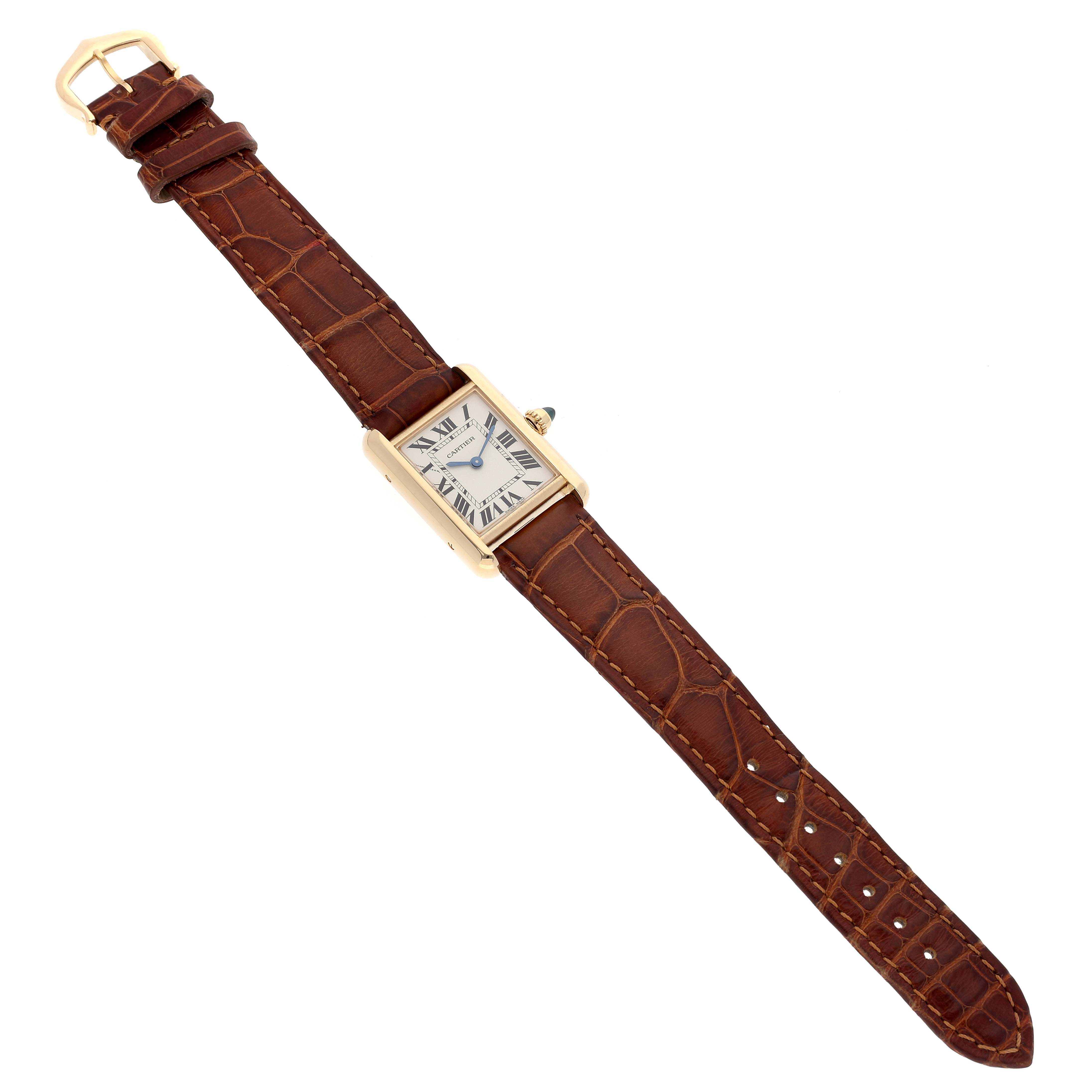 The Cartier Tank Louis W1529856 Women's Yellow Gold Silver Dial W1529856 Women's Yellow Gold Silver Dial model watch is shown from a top-down angle, displaying the face and full leather strap.