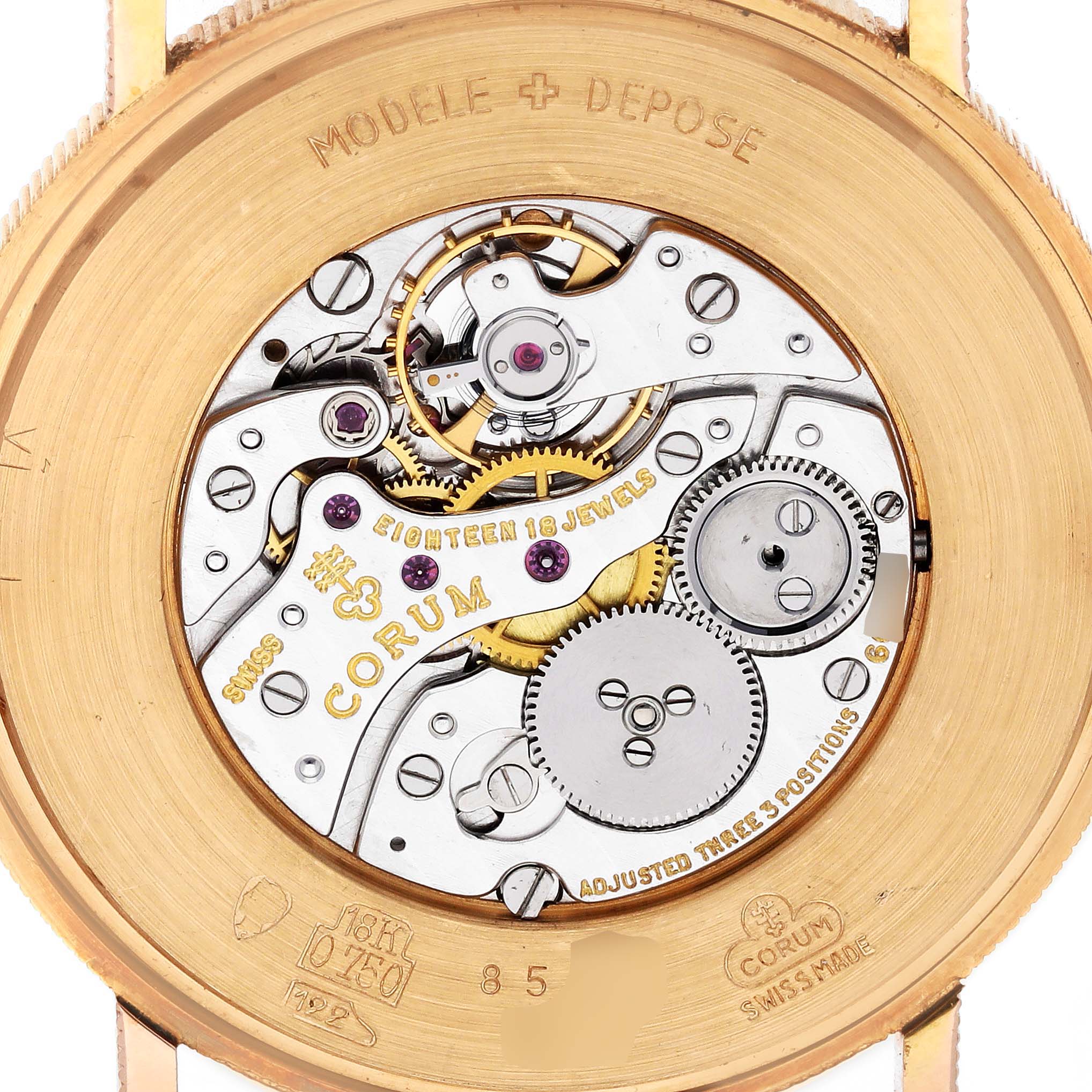 The image shows the back view of a Corum Coin Watch 4414556 Men's Yellow Gold Champagne Dial 4414556 Men's Yellow Gold Champagne Dial, highlighting its intricate mechanical movement.