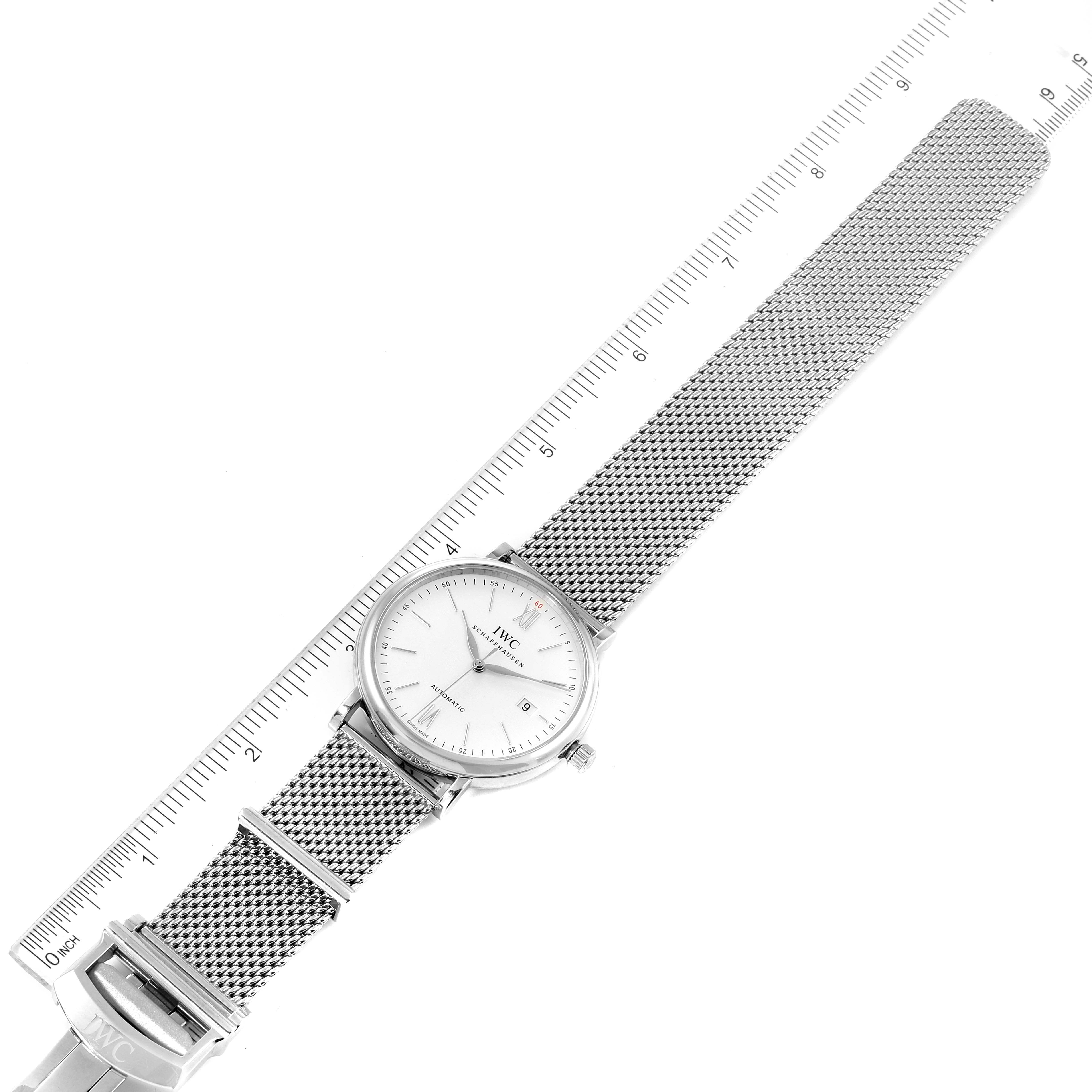The image shows an IWC Portofino IW356505 Men's Stainless Steel Silver Dial IW356505 Men's Stainless Steel Silver Dial watch at a slight angle, highlighting the face, mesh strap, and clasp, accompanied by a ruler.