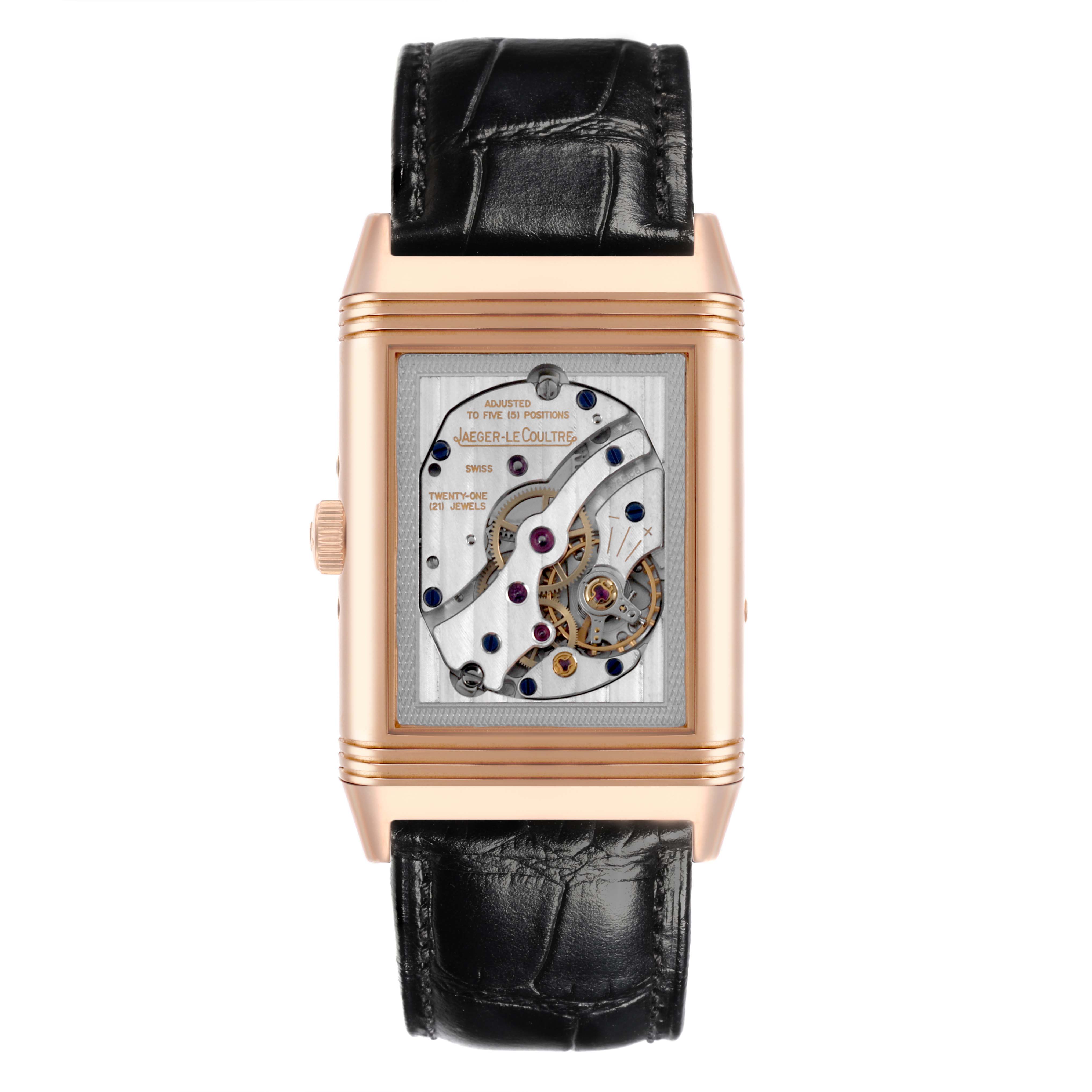The image shows a Jaeger LeCoultre Reverso Q3752520 Men's Rose Gold Silver Dial Q3752520 Men's Rose Gold Silver Dial watch from the front, highlighting its movement and rectangular case with a leather strap.