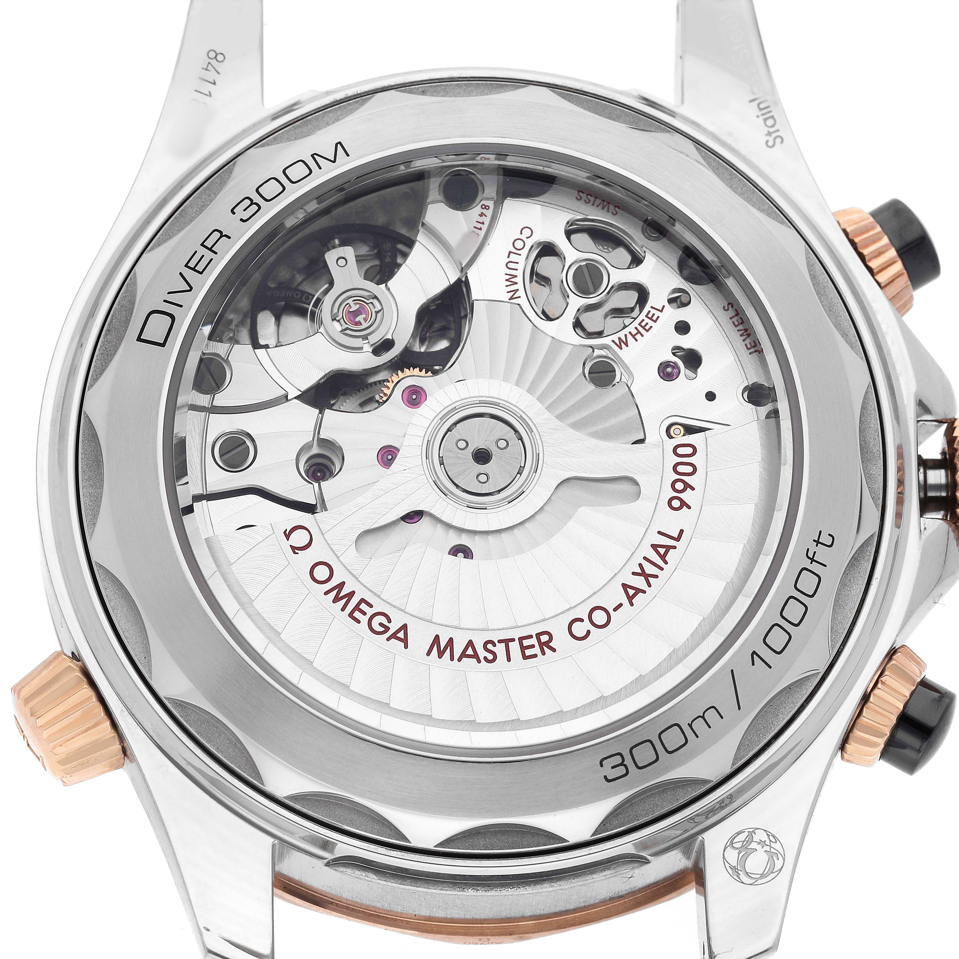 The Omega Seamaster 210.22.44.51.01.001 Men's Steel and Gold (two tone) Black Dial is shown from the back, highlighting the movement and Co-Axial 9900 mechanism with visible parts and engravings.