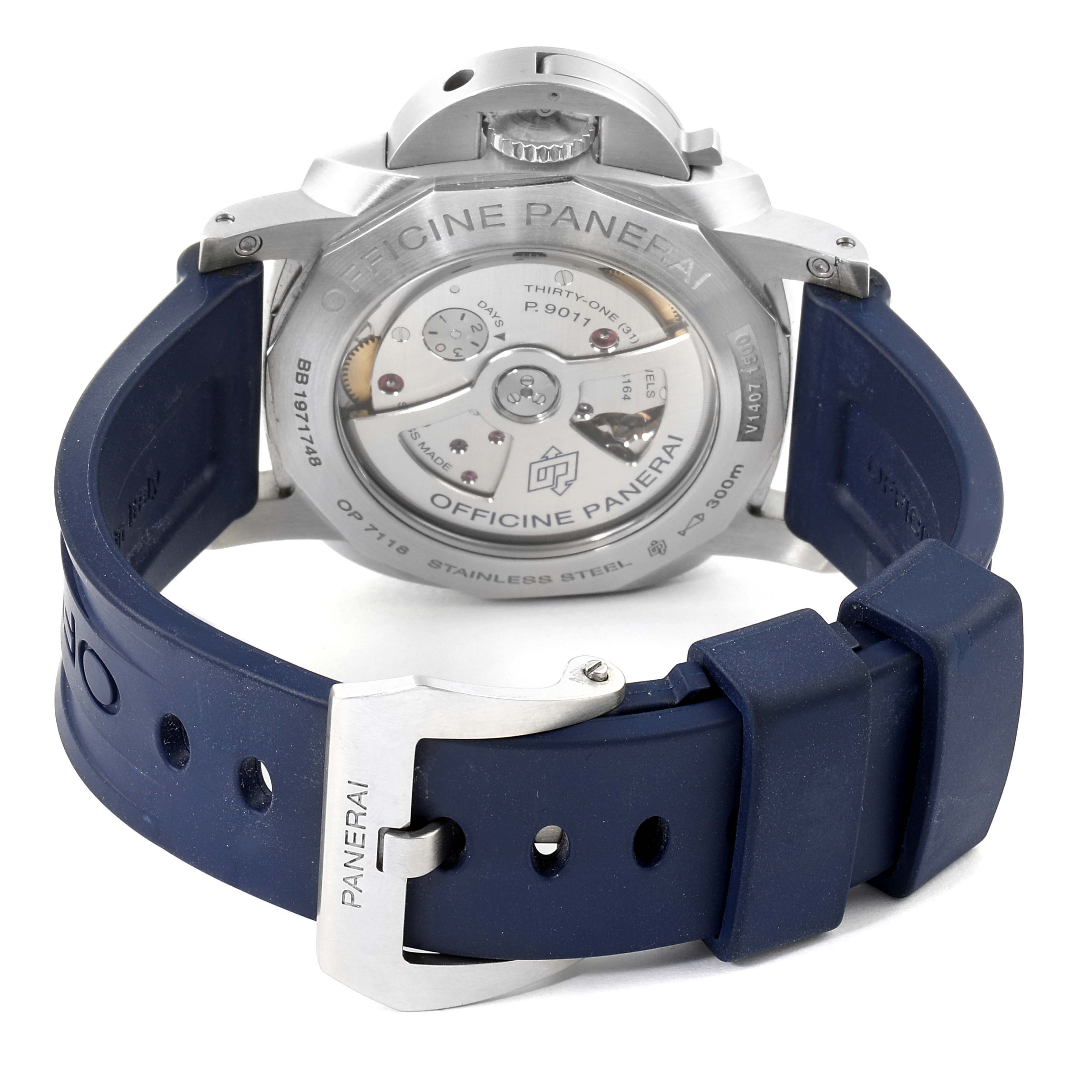 The image shows the back view of a Panerai Luminor PAM01033 Men's Stainless Steel Blue Dial PAM01033 Men's Stainless Steel Blue Dial watch with a visible movement and a blue rubber strap.
