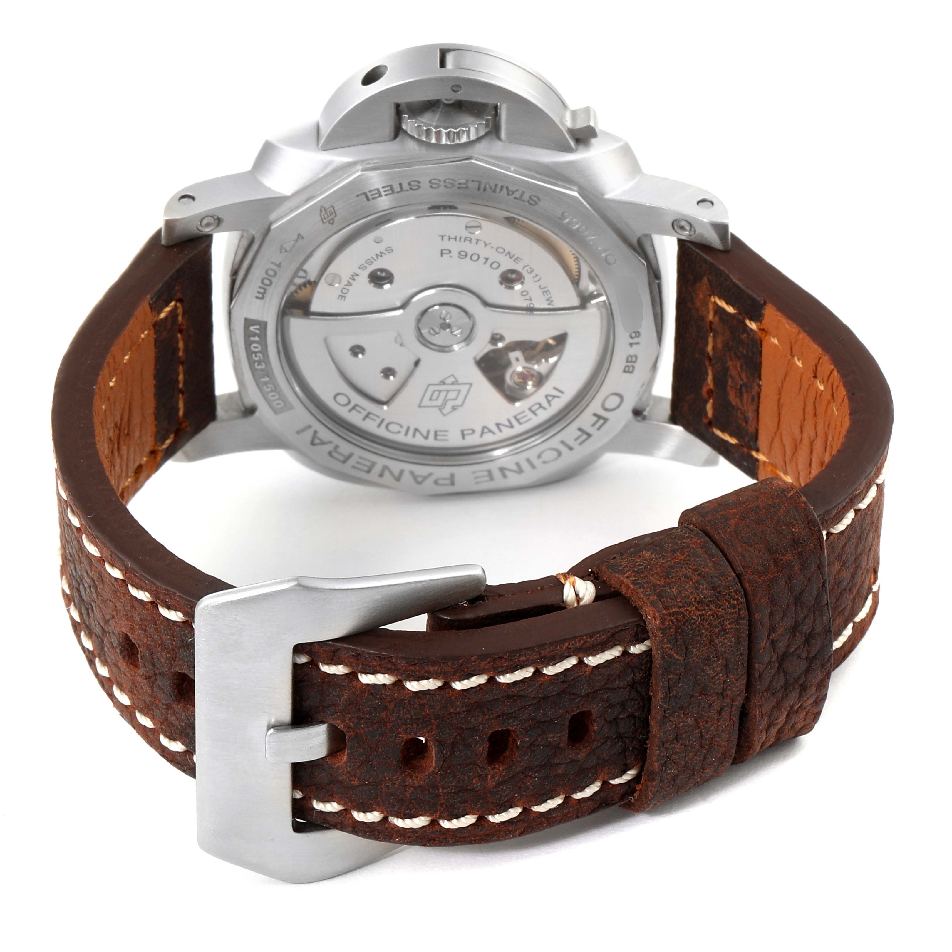 The image shows the back of the Panerai Luminor PAM01392 Men
s Stainless Steel Black Dial PAM01392 Men
s Stainless Steel Black Dial watch, highlighting the mechanism and brown leather strap with a silver buckle.