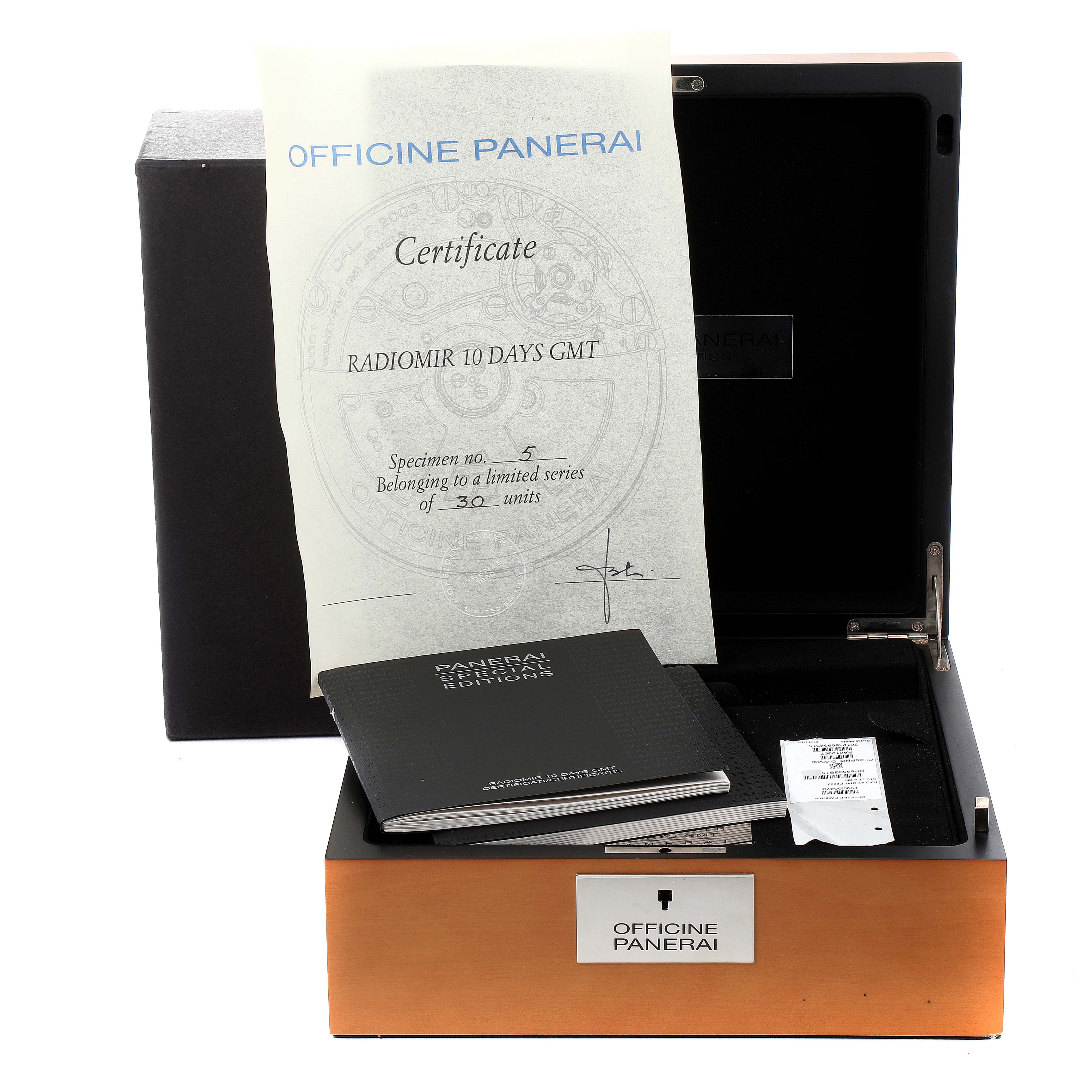 The image shows the packaging and accessories for a Panerai Radiomir PAM00473 men's watch, including the box, certificate, and booklet.