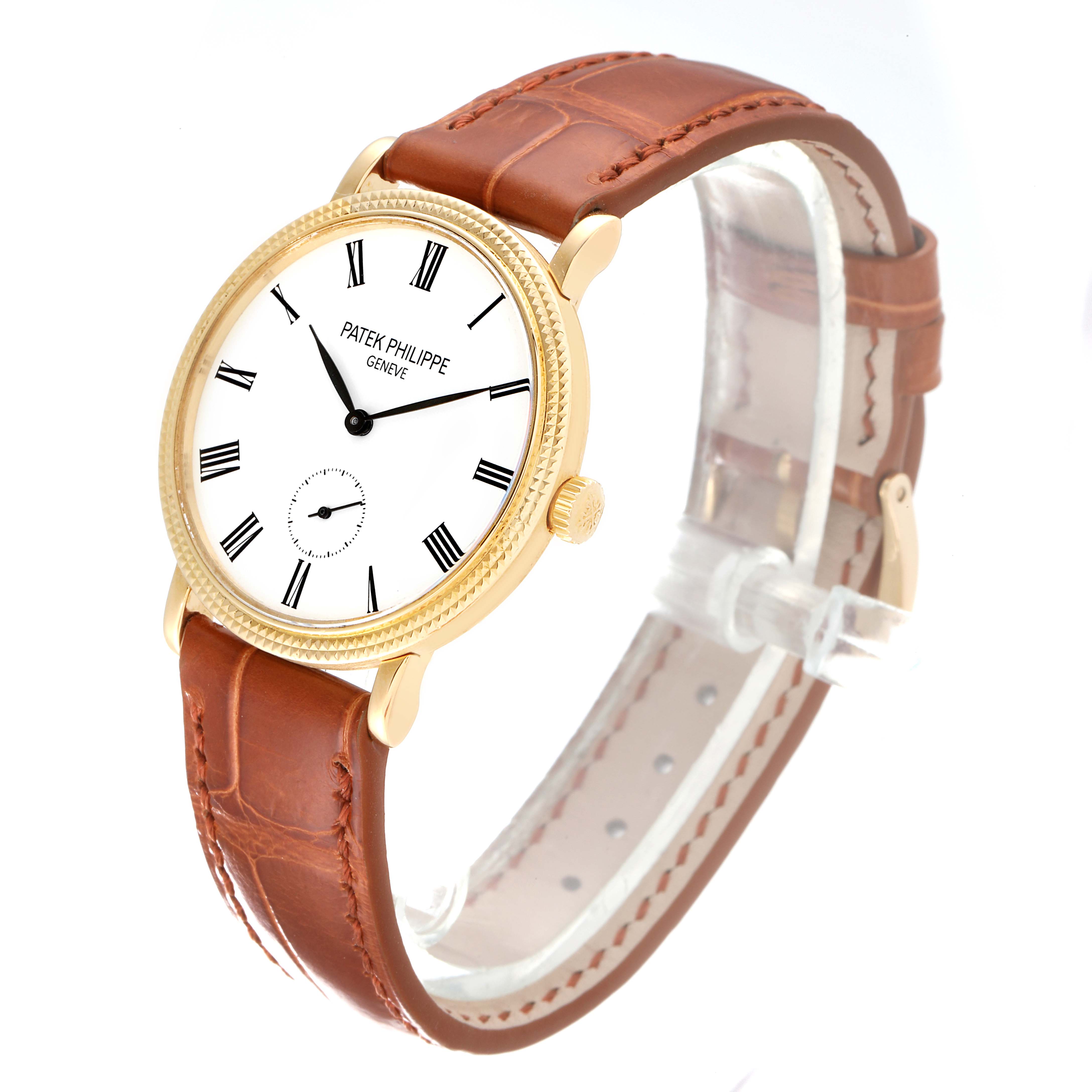 The Calatrava model by Patek Philippe is shown at an angle highlighting its gold case, white dial, and brown leather strap.