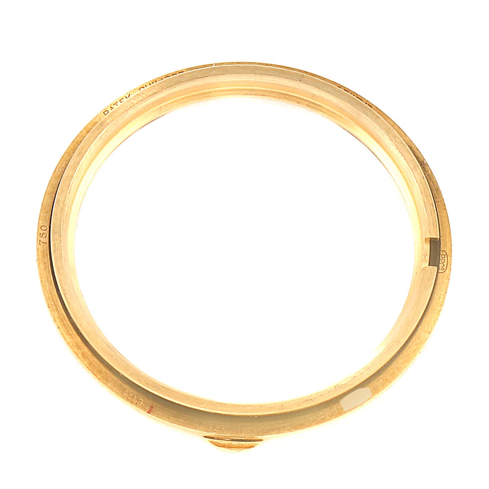 The image shows the bezel of a Patek Philippe Calatrava 7119J Men's Yellow Gold White Dial 7119J Men's Yellow Gold White Dial watch, viewed from above.