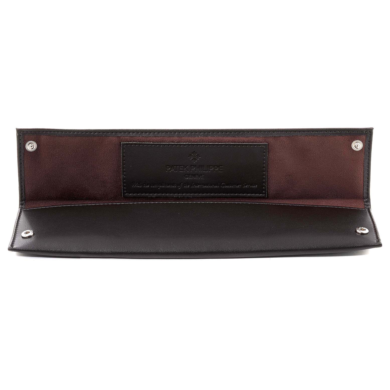 This image shows an open leather watch pouch for the Calatrava model by Patek Philippe, branded inside.