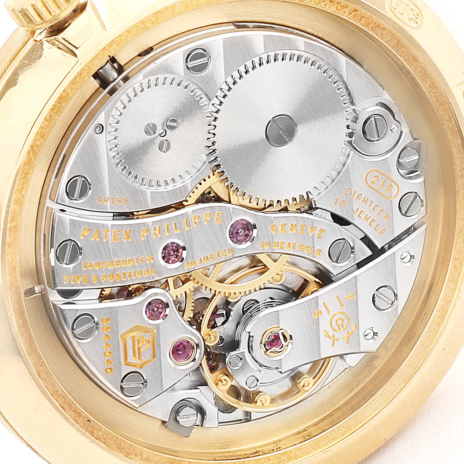 This image shows the intricate movement mechanism of the Patek Philippe Calatrava 7119J Men's Yellow Gold White Dial 7119J Men's Yellow Gold White Dial watch, viewed from the back case.