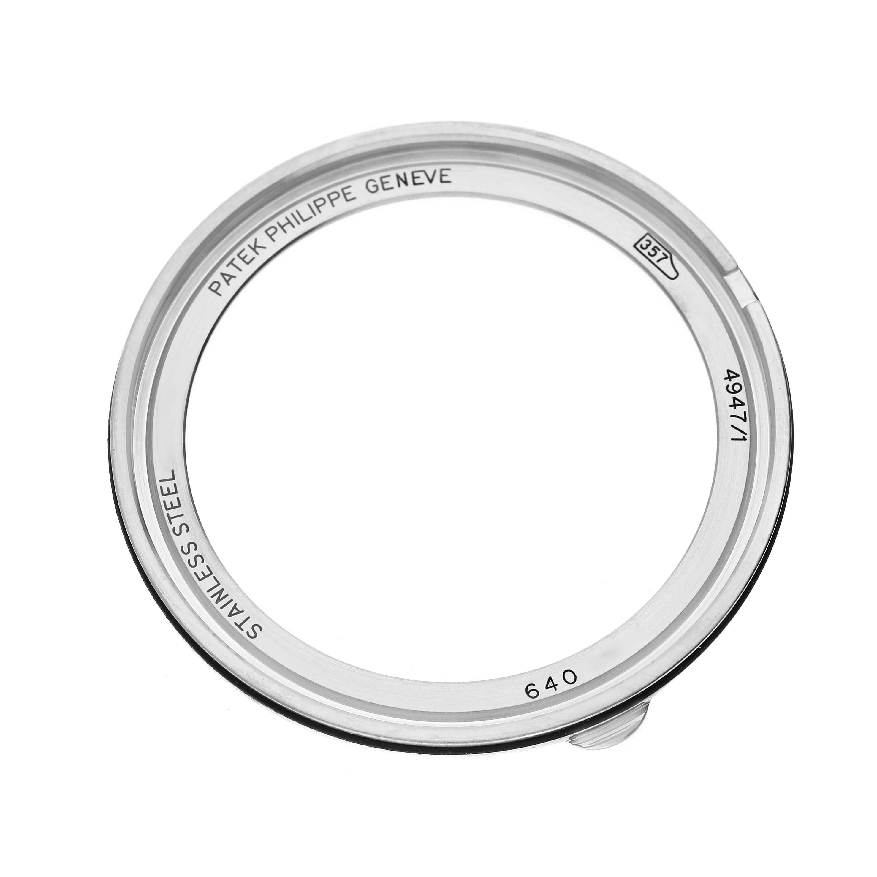 The image shows a top-down view of the bezel for a Patek Philippe Complications 4947/1A-001 Men's Stainless Steel Blue Dial watch, engraved with brand details.