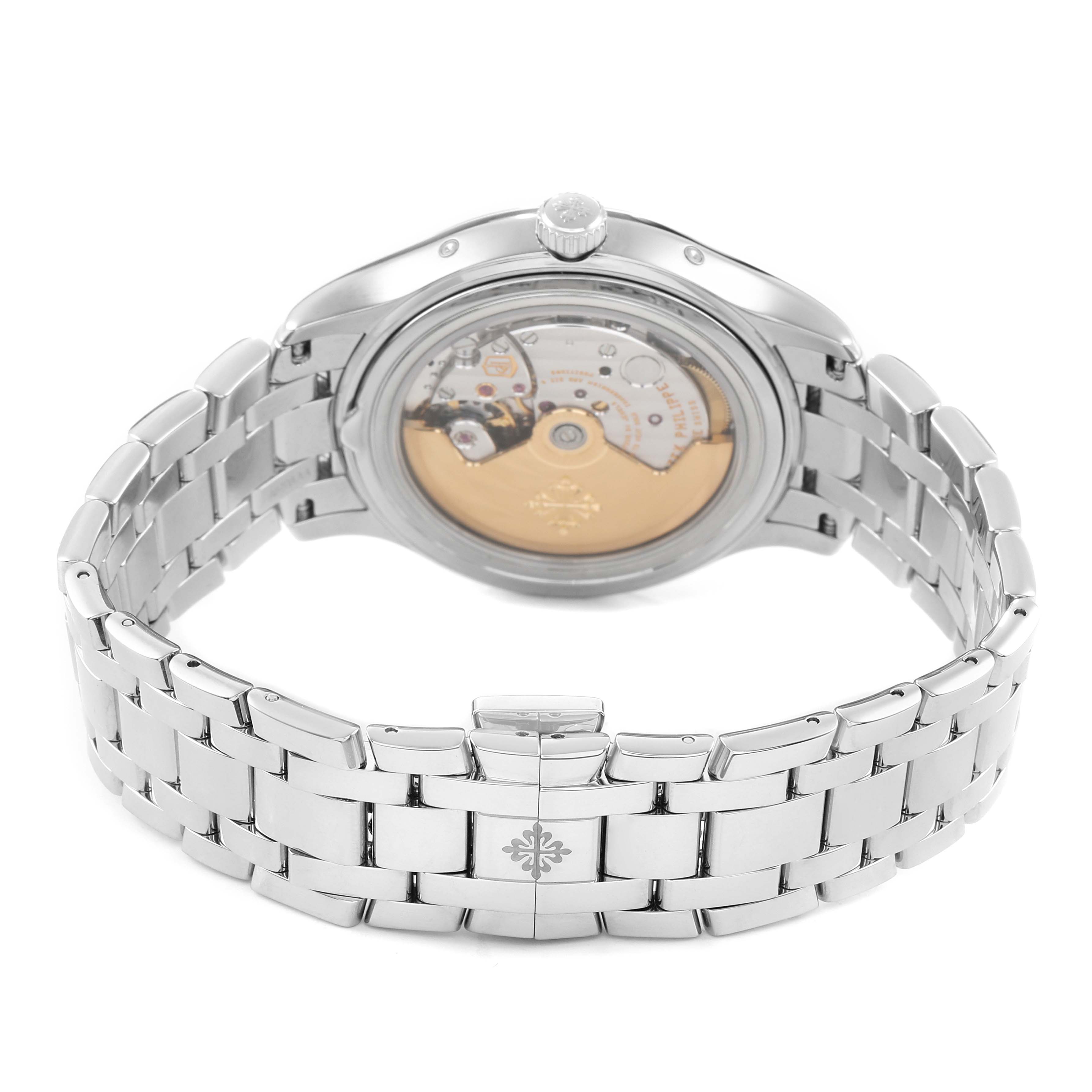 The image shows the back of the Patek Philippe Complications 4947/1A-001 Men's Stainless Steel Blue Dial watch, highlighting the movement and bracelet.