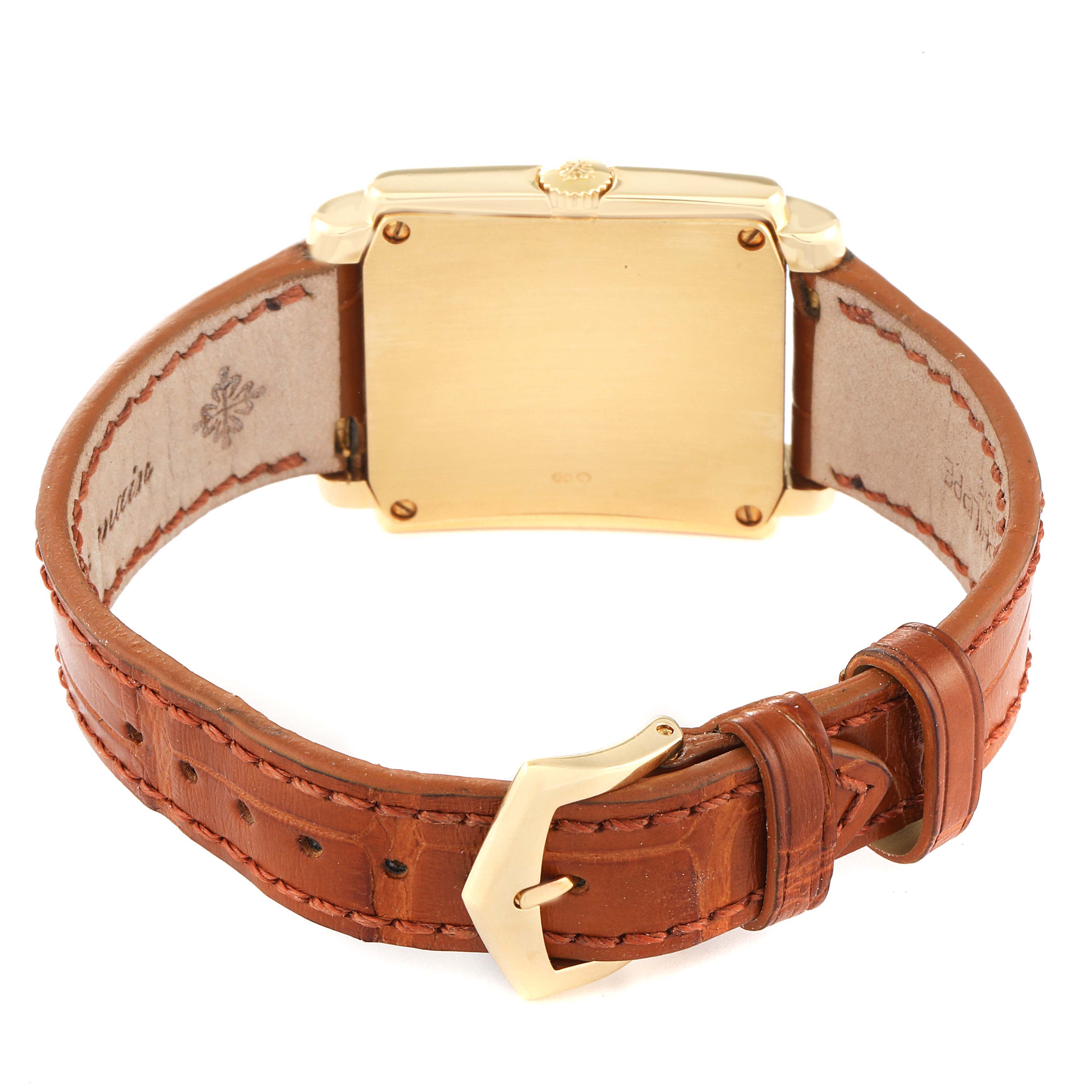 The image displays the back view of a Patek Philippe Gondolo 5024J Men's Yellow Gold Silver Dial 5024J Men's Yellow Gold Silver Dial watch, showcasing the gold case and brown leather strap with a gold buckle.