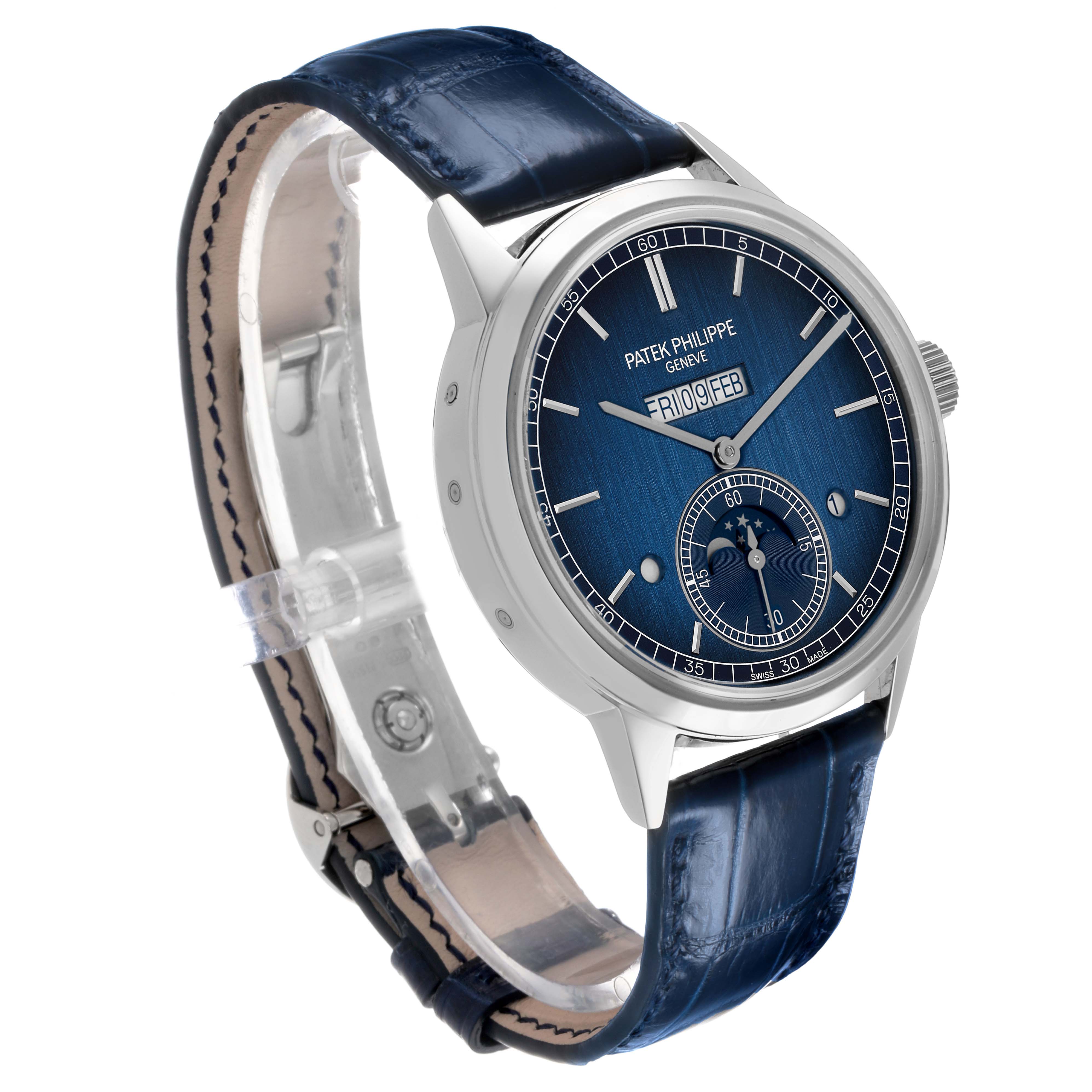 The Patek Philippe Complications 5236 Men's Platinum Blue Dial watch is shown at a three-quarter angle, displaying the face, dial, and blue leather strap.