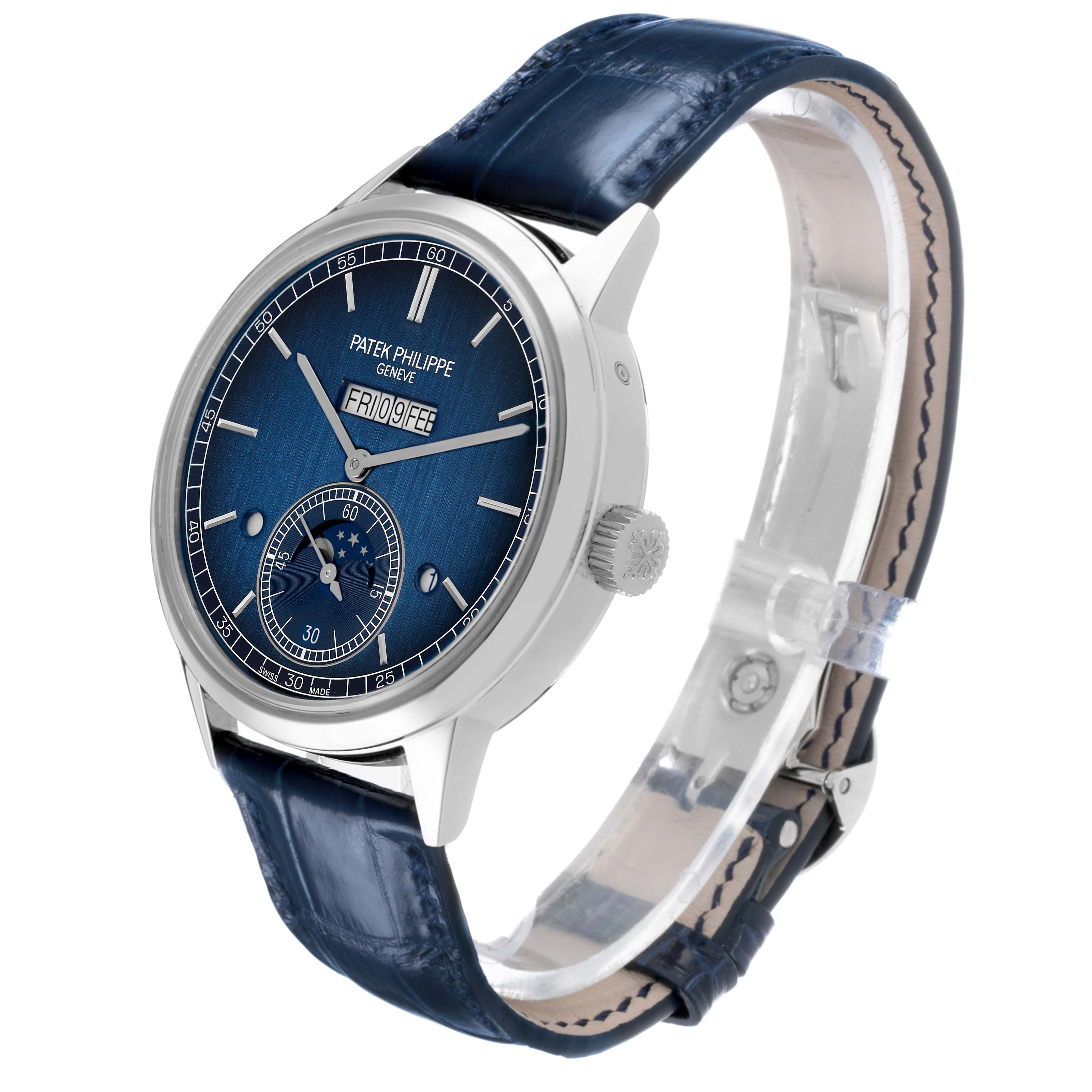The image shows a Patek Philippe Complications 5236 Men's Platinum Blue Dial watch at a three-quarter angle, displaying the face, crown, and strap.