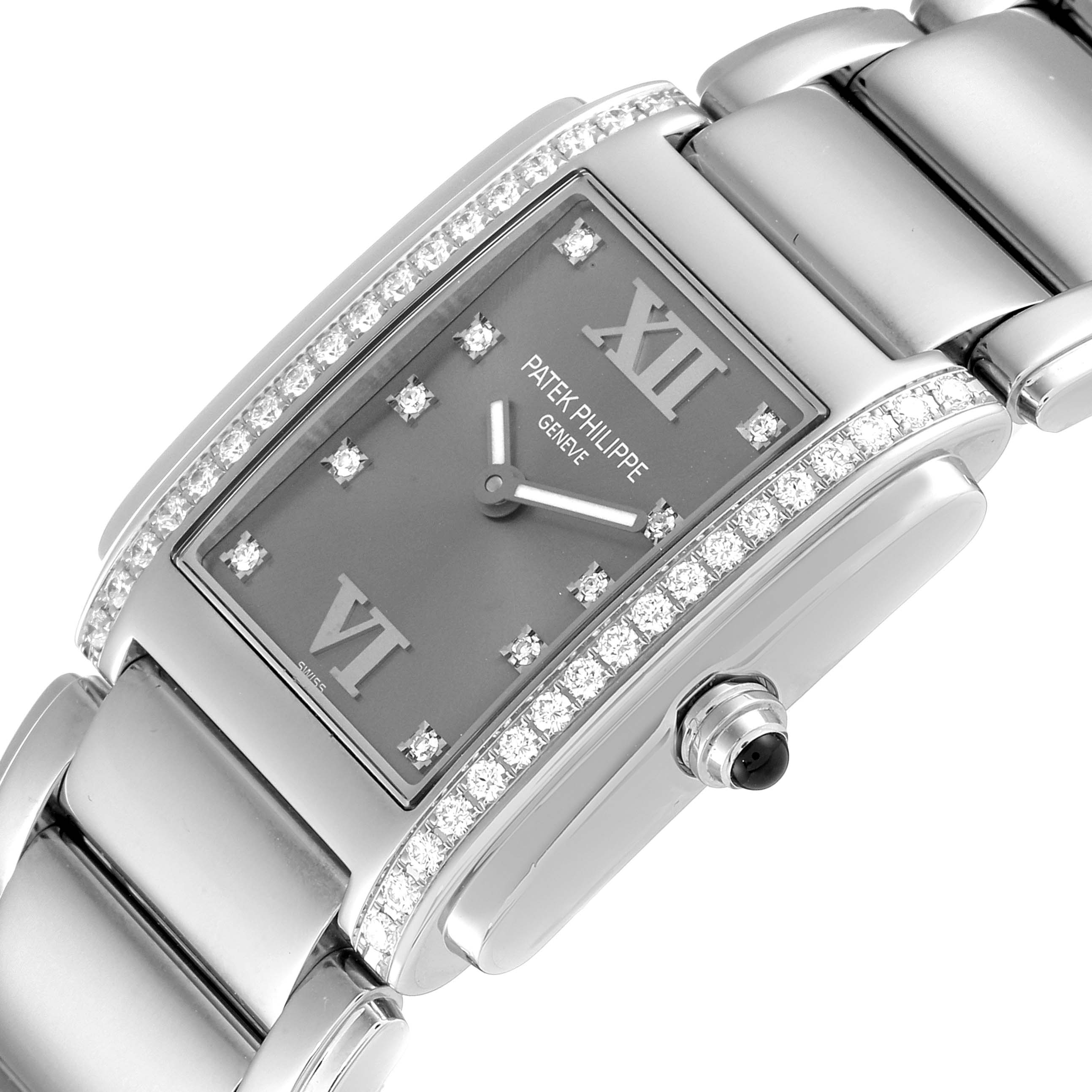 This image shows a close-up of a Patek Philippe Twenty-4 4910/10A-010 Women's Stainless Steel Grey Dial 4910/10A-010 Women's Stainless Steel Grey Dial watch, highlighting its diamond bezel, grey dial, and part of the bracelet.