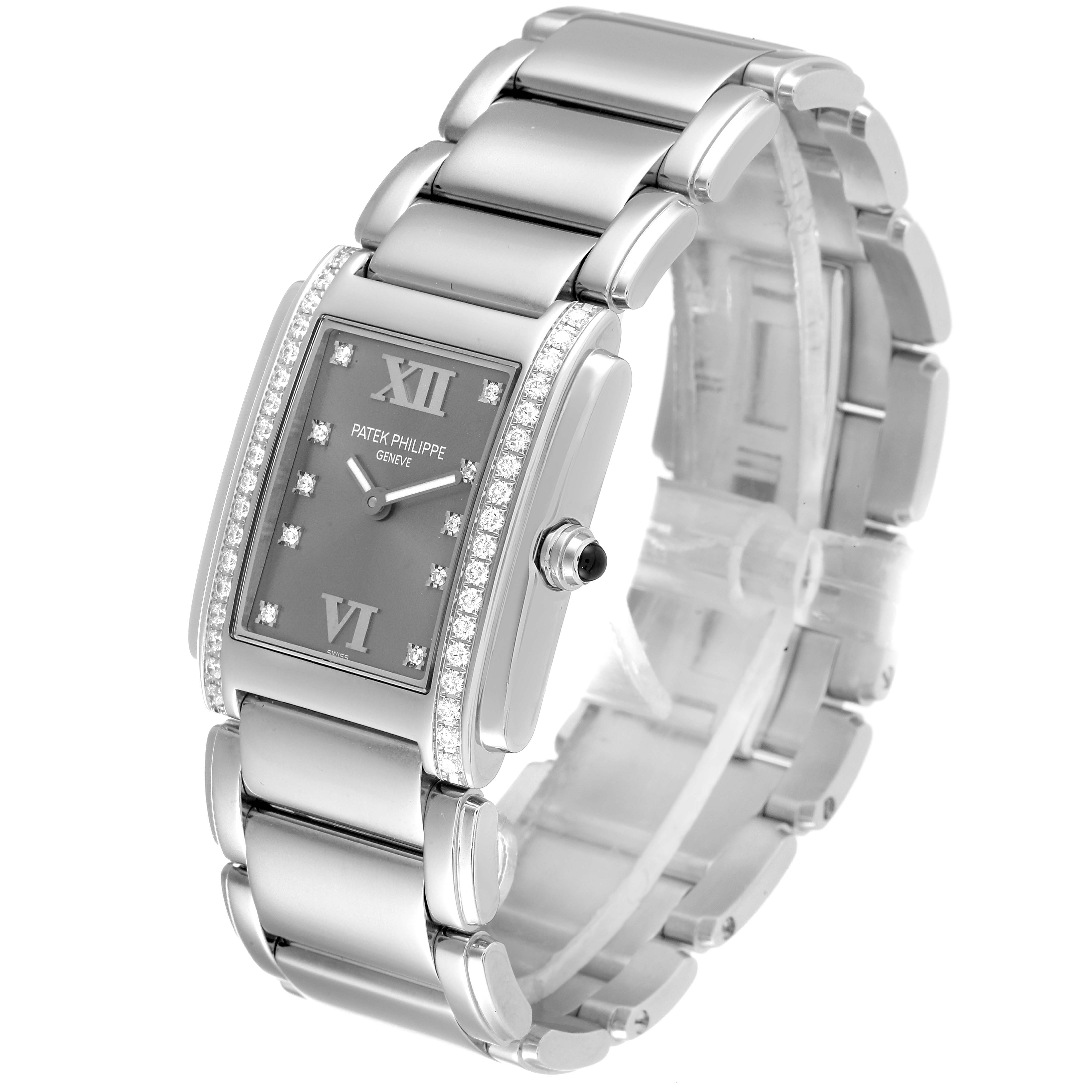 The image shows a Patek Philippe Twenty-4 4910/10A-010 Women's Stainless Steel Grey Dial 4910/10A-010 Women's Stainless Steel Grey Dial watch at a three-quarter angle, highlighting its face, bezel, crown, and bracelet.