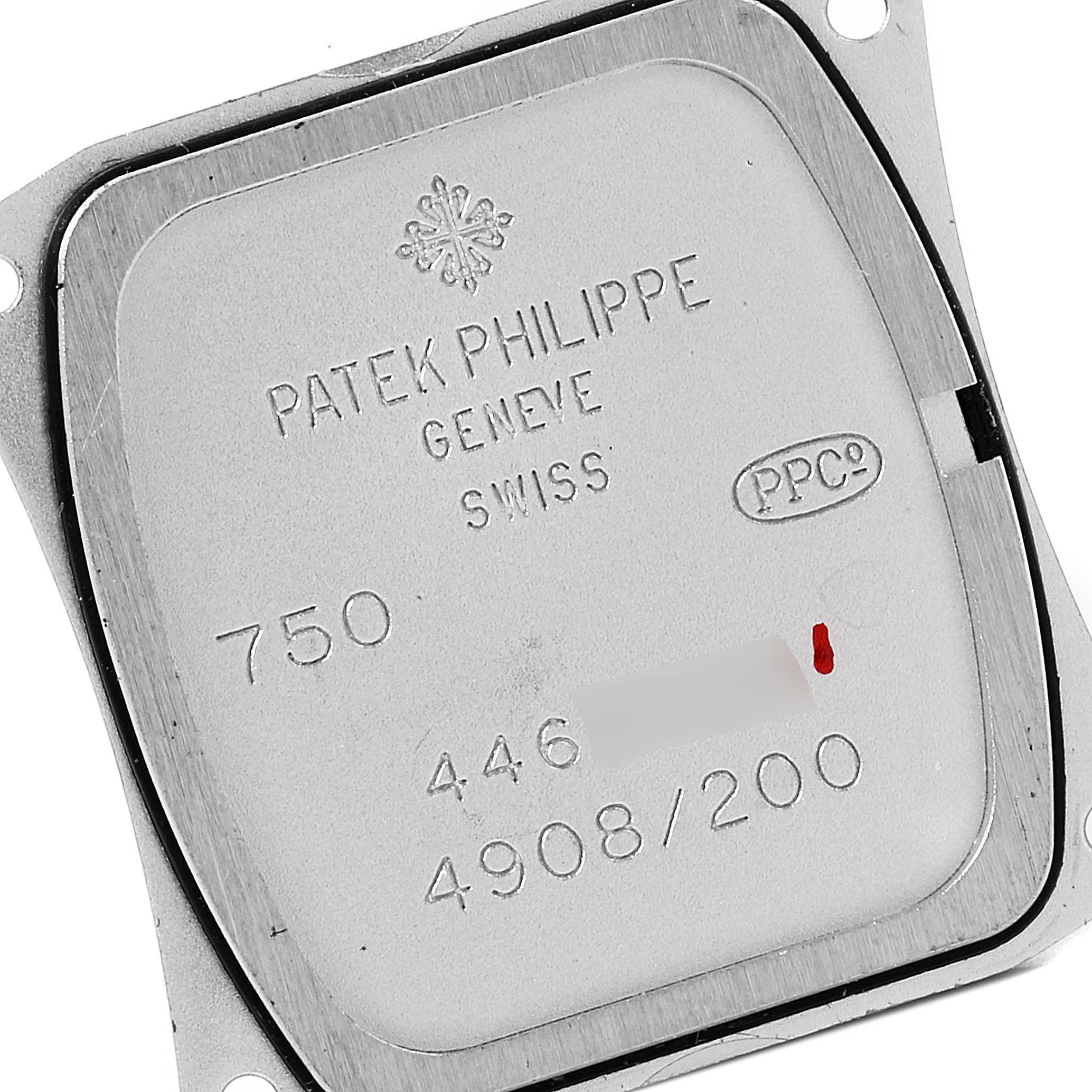The image shows the back cover of a Patek Philippe Twenty-4 4908/200G-001 Women's White Gold Grey Dial 4908/200G-001 Women's White Gold Grey Dial model watch, displaying its engravings and serial number.