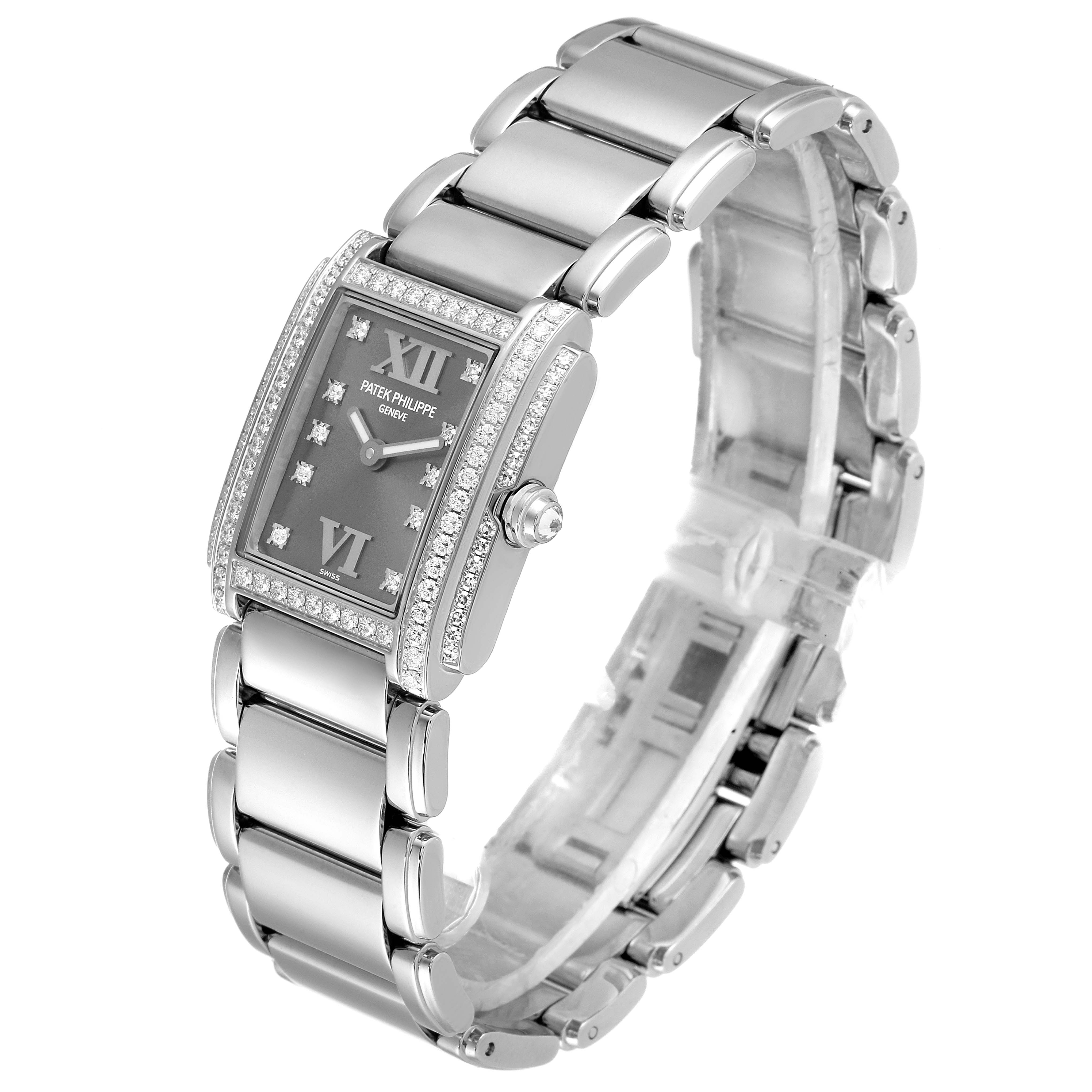 The Patek Philippe Twenty-4 4908/200G-001 Women's White Gold Grey Dial 4908/200G-001 Women's White Gold Grey Dial watch is shown in a three-quarter angle highlighting its rectangular face, bracelet, crown, and diamond accents.