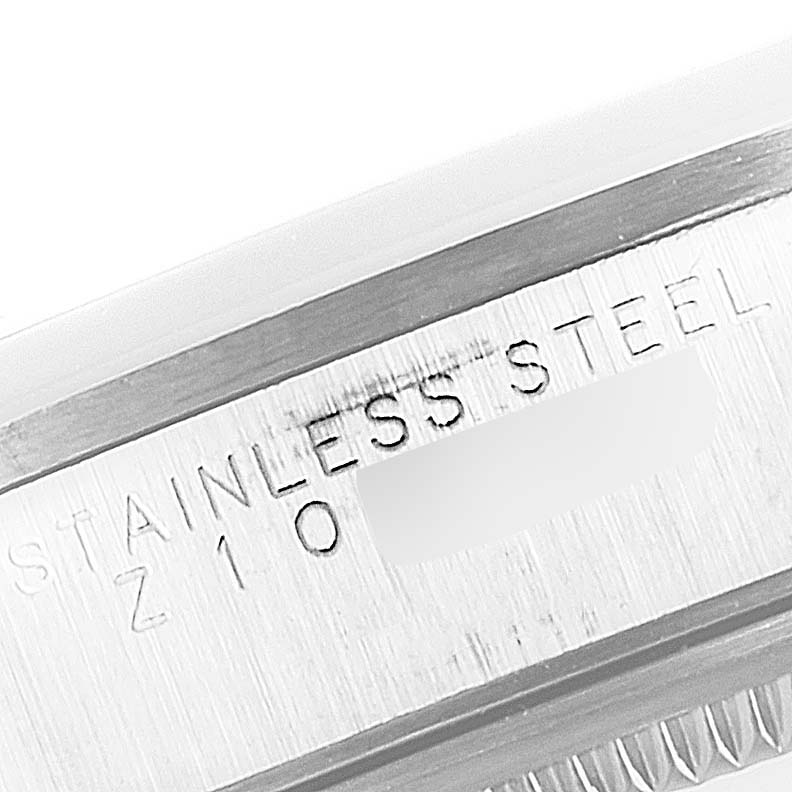 This close-up image shows the engraved stainless steel information on the case of a Rolex Air-King 14000 Men's Stainless Steel Black Dial 14000 Men's Stainless Steel Black Dial watch.
