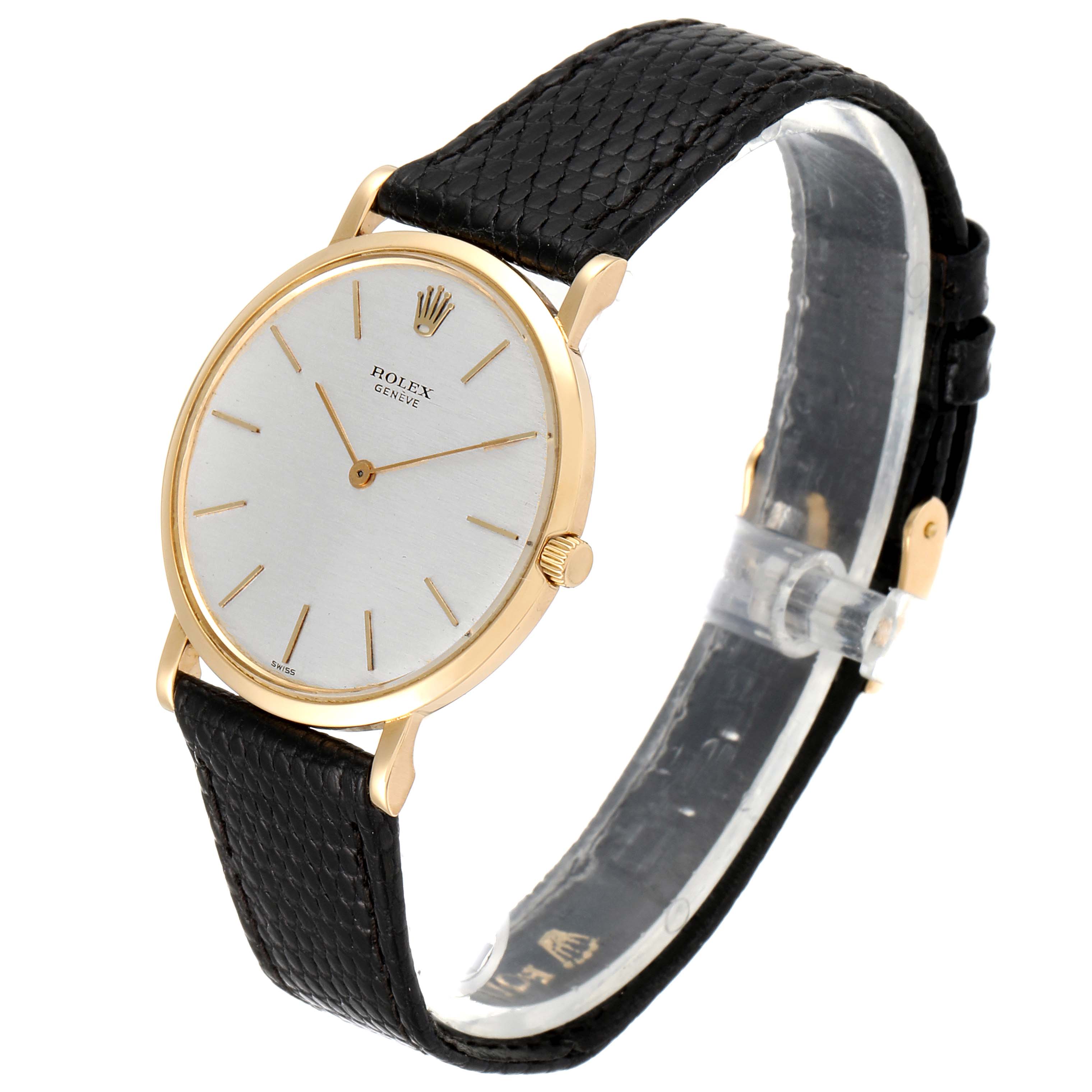 The image shows a side angle of the Rolex Cellini 9576 Men's Yellow Gold Silver Dial 9576 Men's Yellow Gold Silver Dial watch, displaying its round dial and black leather strap.