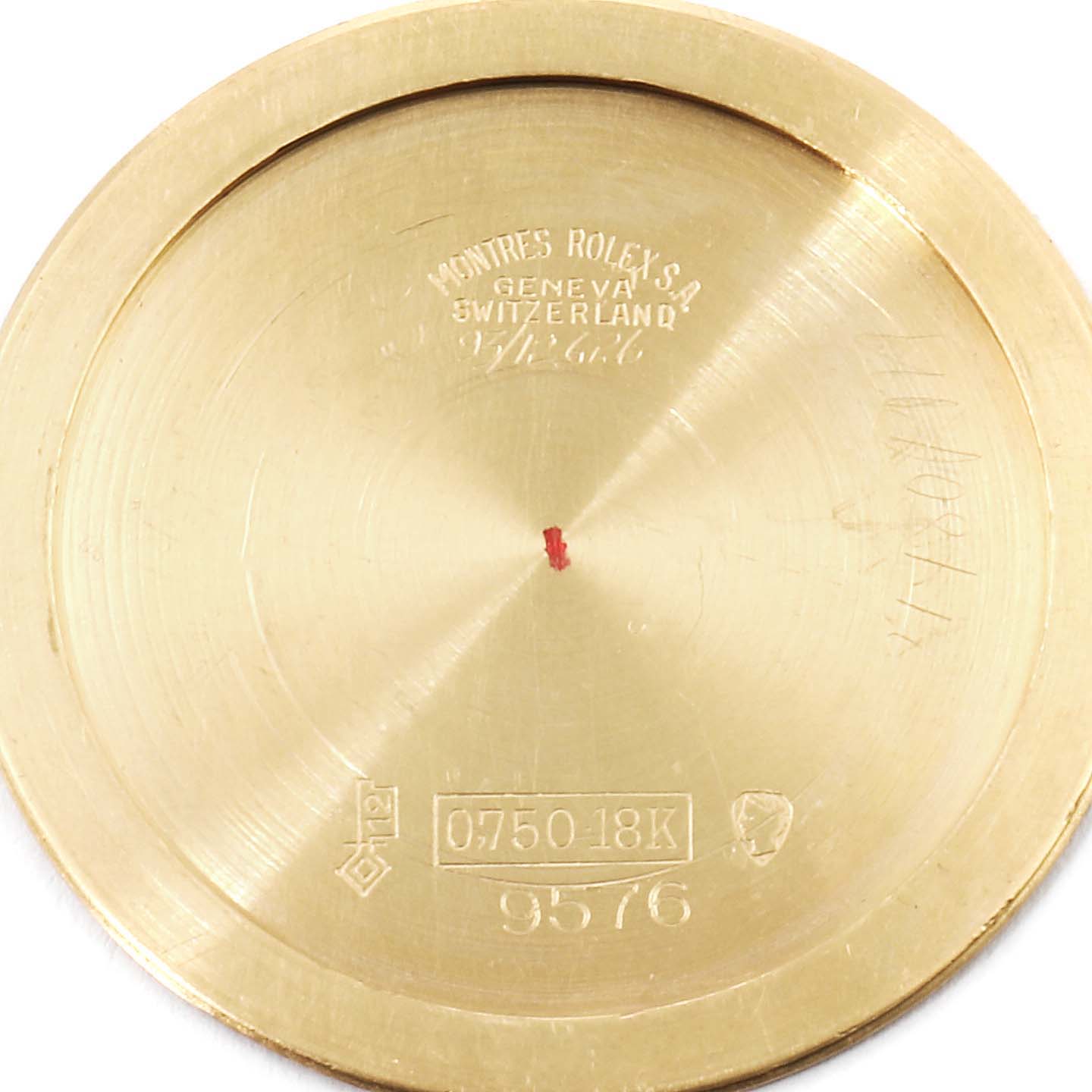 This image shows the inside case back of a Rolex Cellini 9576 Men's Yellow Gold Silver Dial 9576 Men's Yellow Gold Silver Dial watch, displaying engraving details and gold hallmarks.