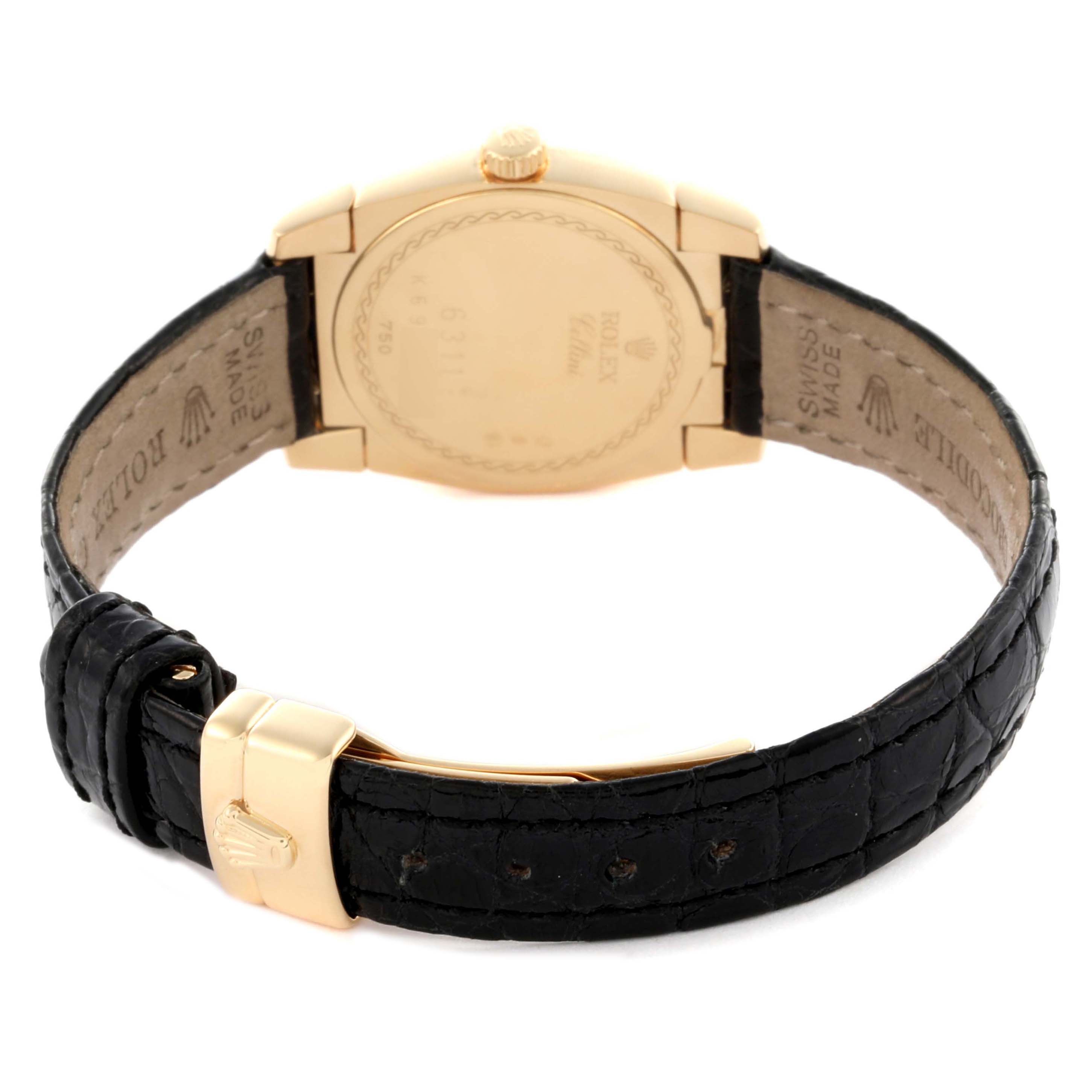 The image shows the back view of a Rolex Cellini 6311 Women's Yellow Gold Mother of Pearl Dial watch, highlighting its leather strap, clasp, and caseback.