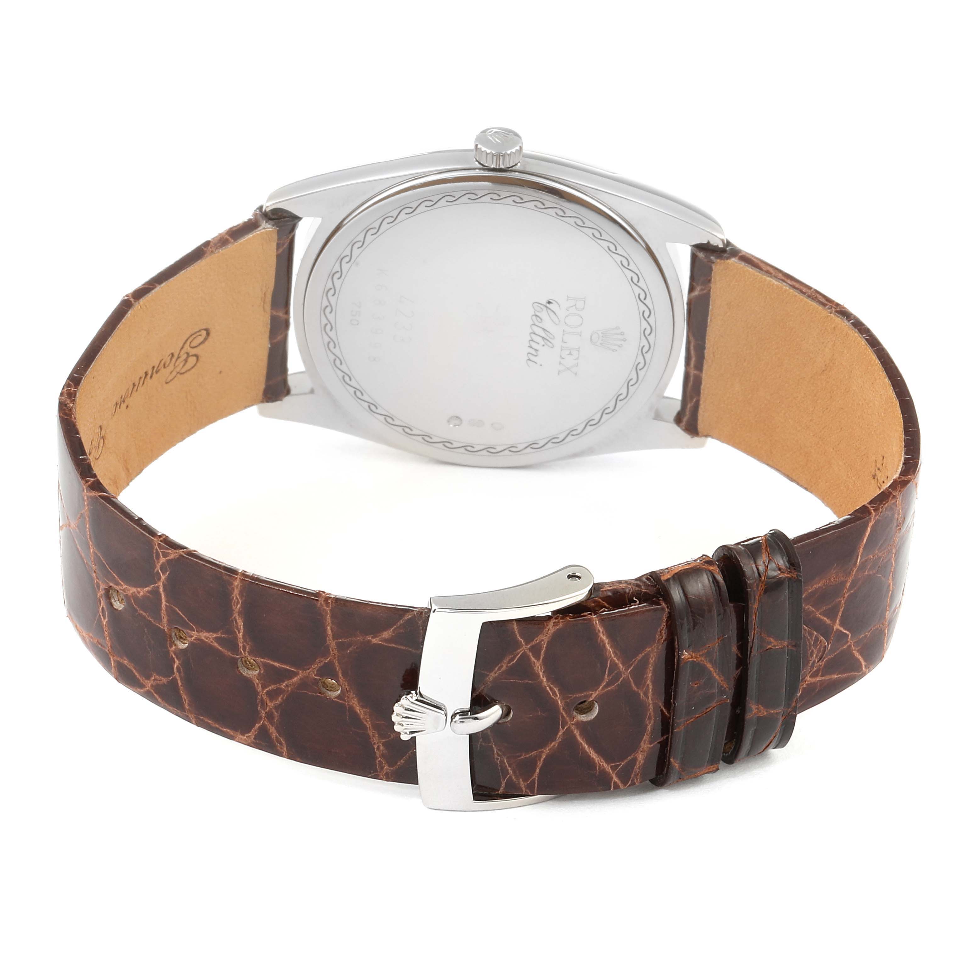 The image shows the back of the Rolex Cellini 4233 Men's White Gold Black Dial 4233 Men's White Gold Black Dial watch, highlighting the case back, crown, and brown leather strap with a buckle clasp.