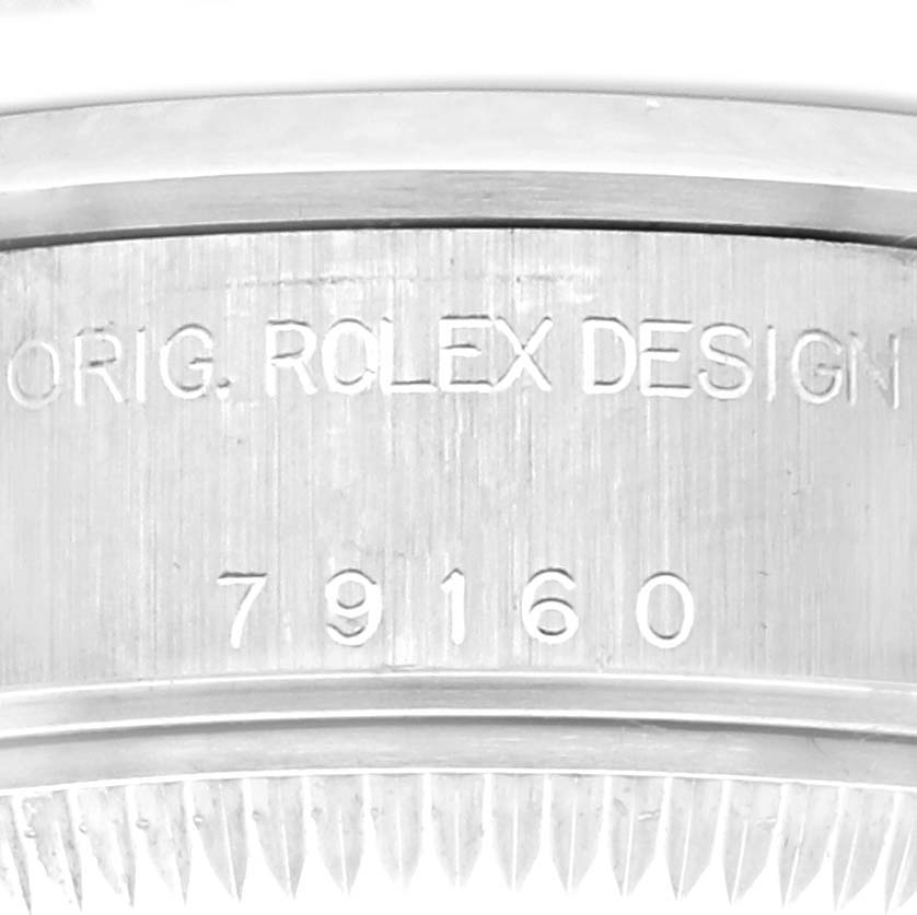 The image shows a close-up of the engraved side of the Rolex Date 79160 Women
s Stainless Steel Blue Dial 79160 Women
s Stainless Steel Blue Dial model watch, highlighting the "ORIG. ROLEX DESIGN" inscription and model number.