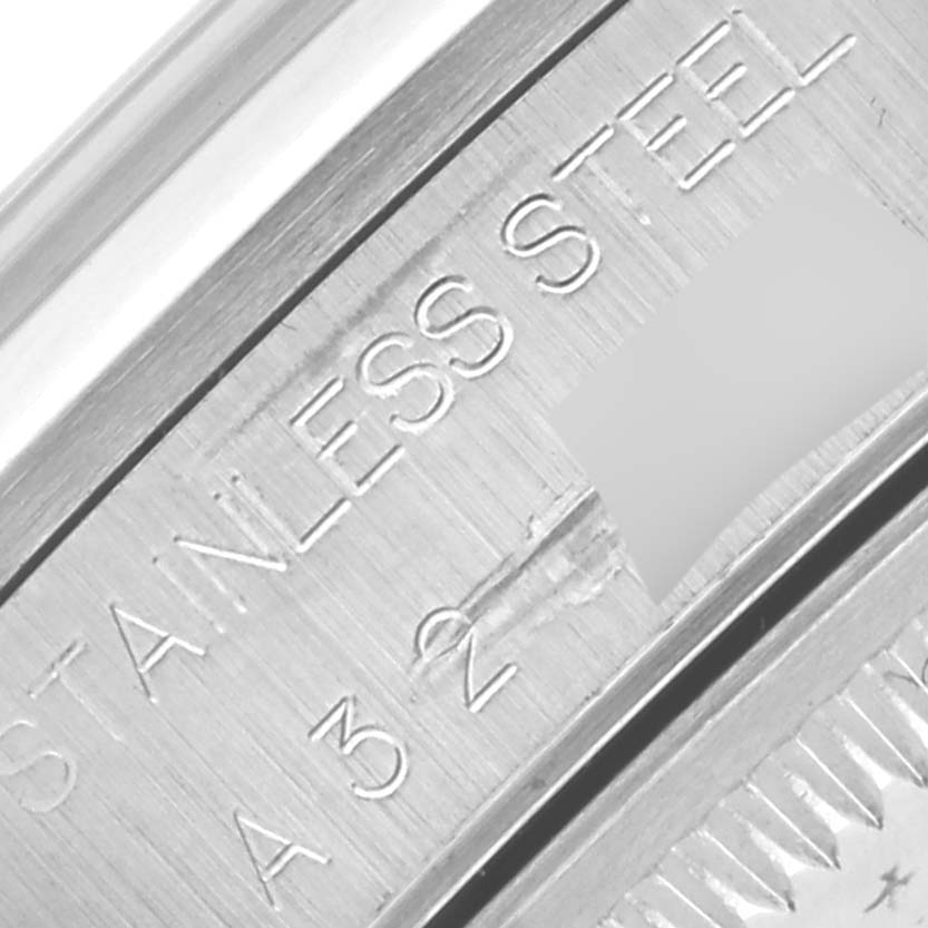 The image shows a close-up of the Rolex Date 15200 Men's Stainless Steel Pink Dial 15200 Men's Stainless Steel Pink Dial model's stainless steel case side with engraved lettering.