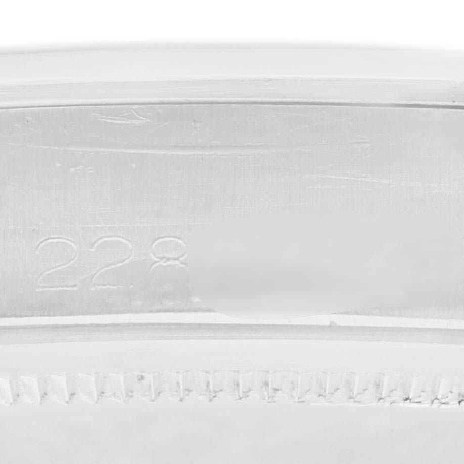The image shows a close-up of the edge and inner part of the Rolex Date 1500 Men's Stainless Steel Silver Dial 1500 Men's Stainless Steel Silver Dial watch bezel.