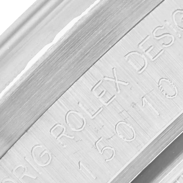 The image shows a close-up of the inner case engraving of a Rolex Date 15010 Men's Stainless Steel Silver Dial 15010 Men's Stainless Steel Silver Dial model watch.