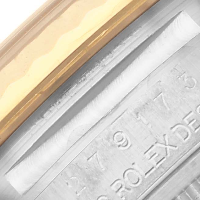 The image shows a close-up of the side of a Rolex Datejust 279173 Women's Steel and Gold (two tone) Champagne Dial 279173 Women's Steel and Gold (two tone) Champagne Dial watch, focusing on the bezel and engraved edge of the case.